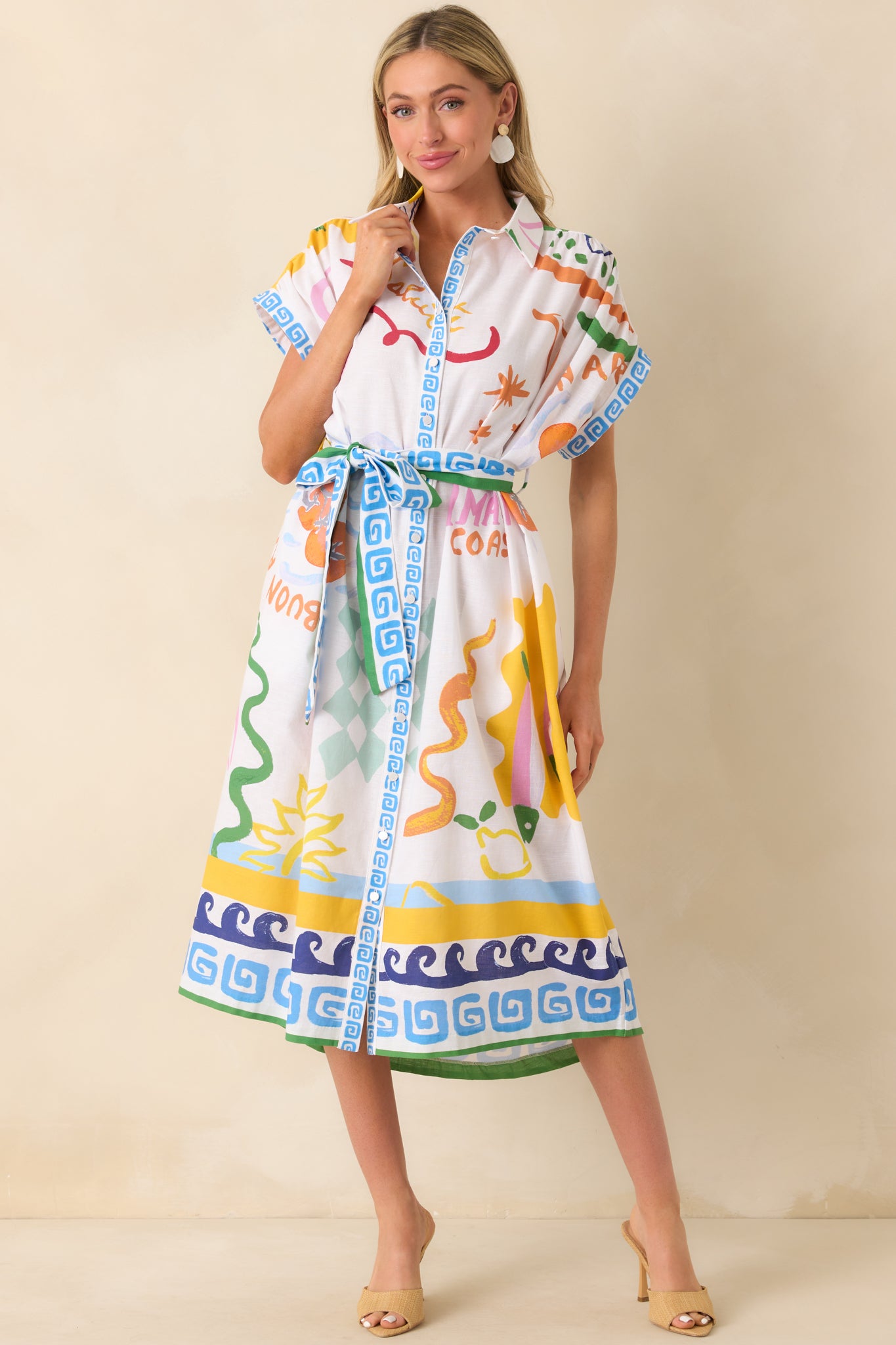 Full body shot focusing on the relaxed yet structured fit of the dress and the playful Summer Spritz pattern.
