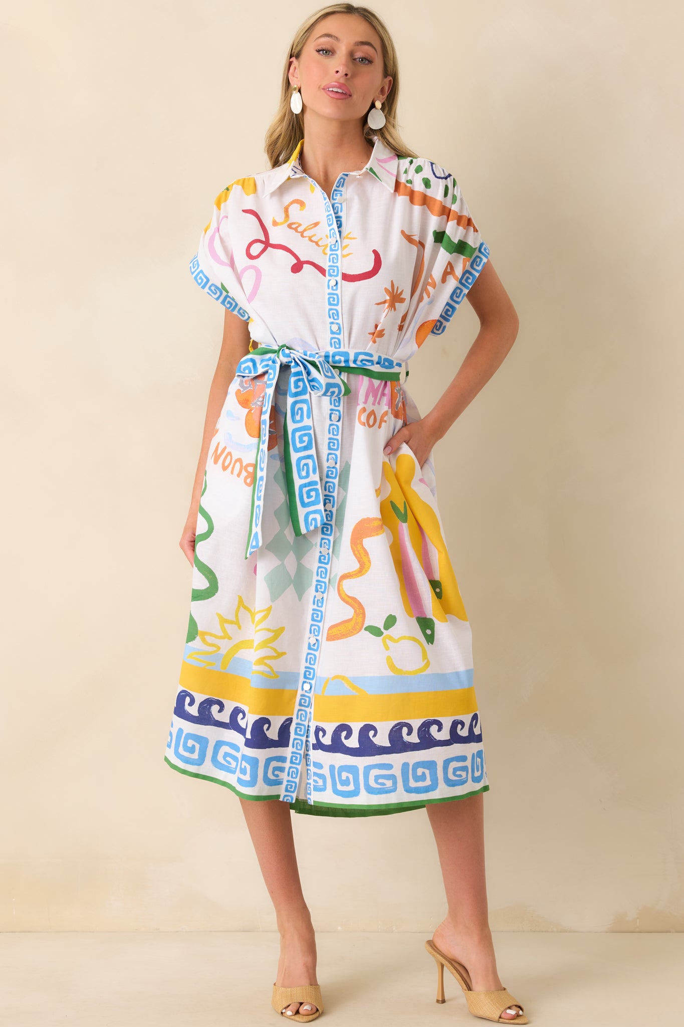 Full body photo emphasizing the colorful print, collared neckline, and placement of the functional pockets.