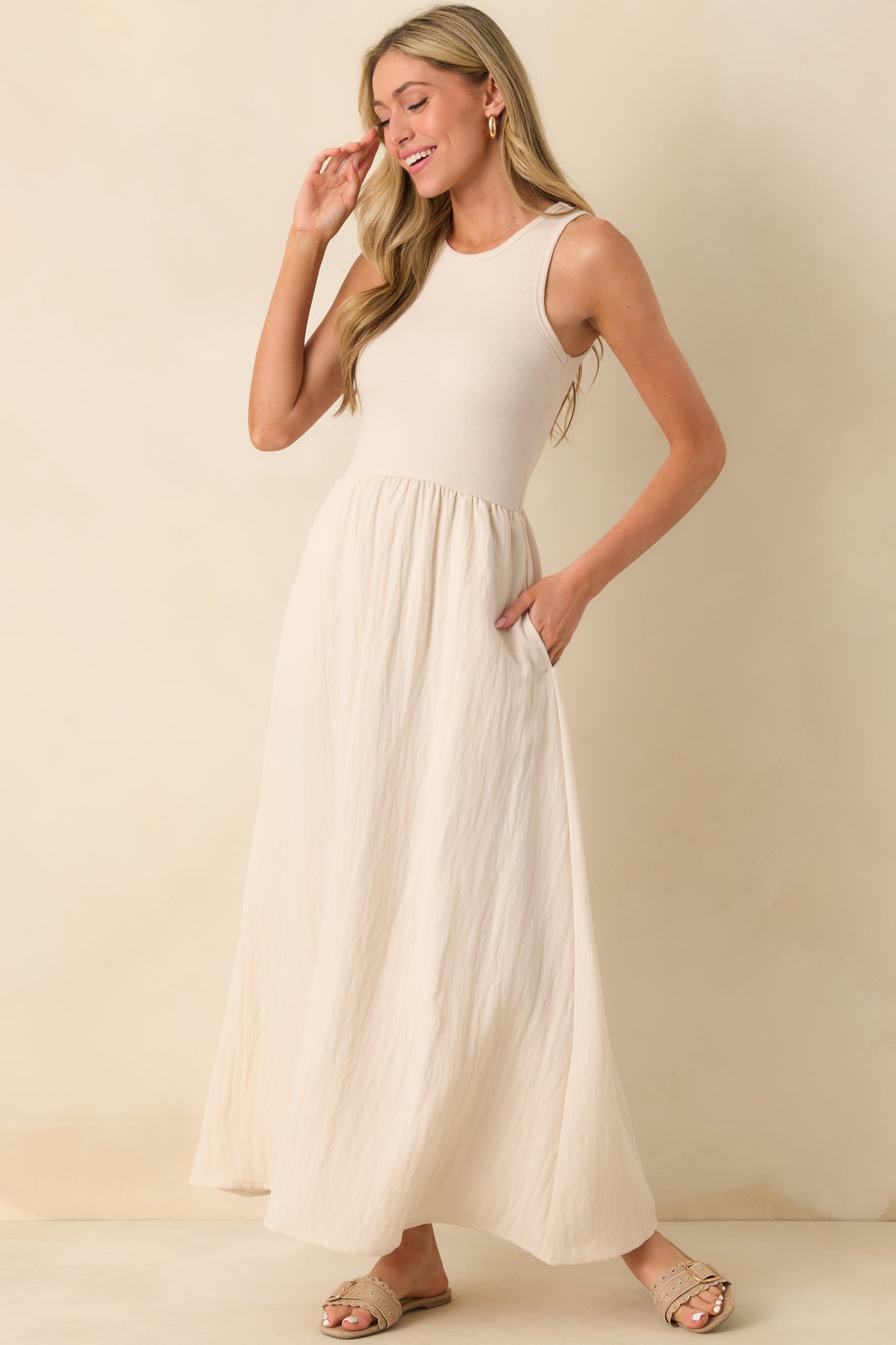 Front-facing full body image highlighting the structure of the crew neckline and the natural drape of the textured skirt.