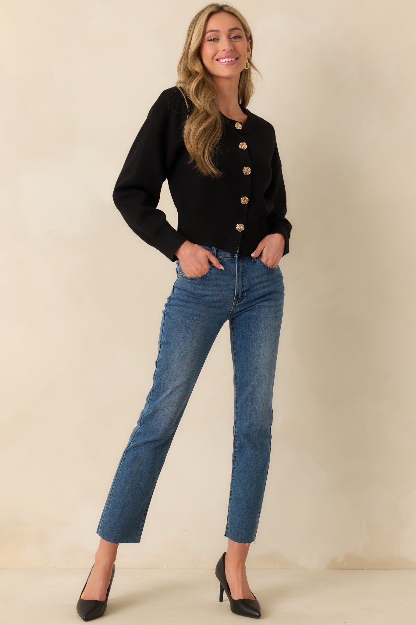 A full-length image showcasing the structured fit of the high rise dark wash jeans with visible belt loops and front pockets.