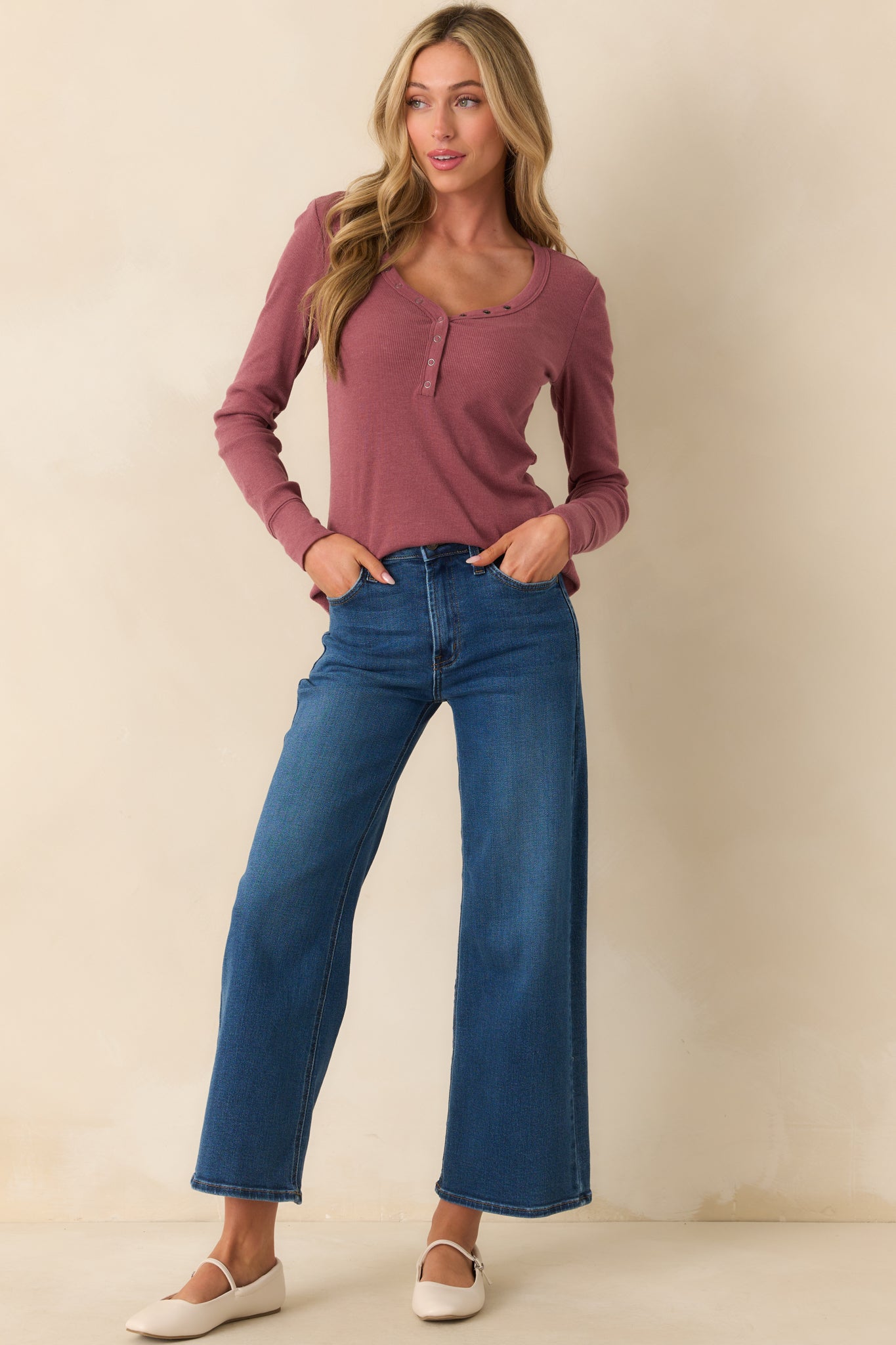 Chic wide-leg jeans with a high waist and slightly cropped length, designed with functional belt loops and pockets, offering a relaxed, fashion-forward fit perfect for any occasion.