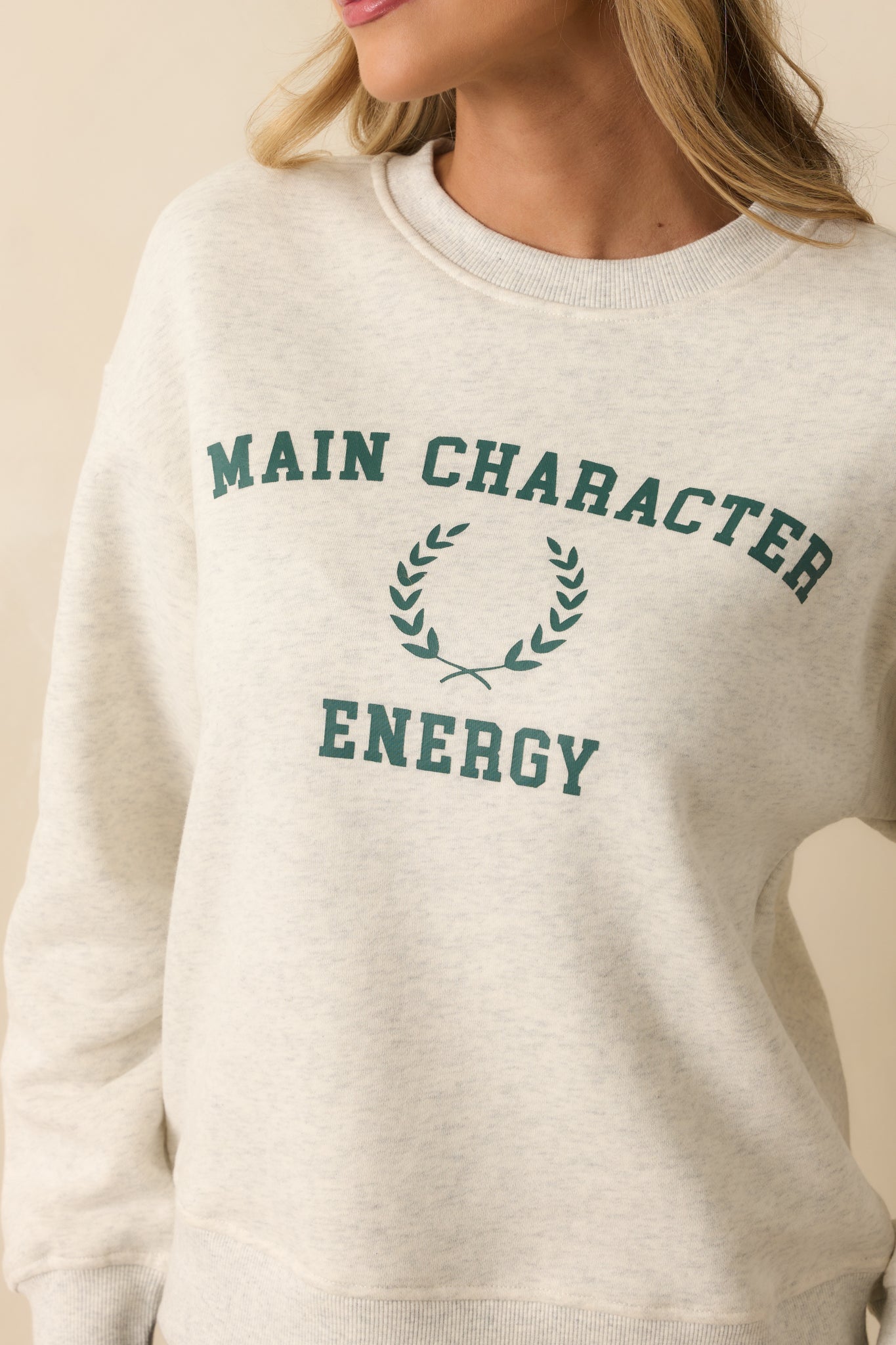 Detailed look at the “Main Character Energy” embroidery and textured stitching.