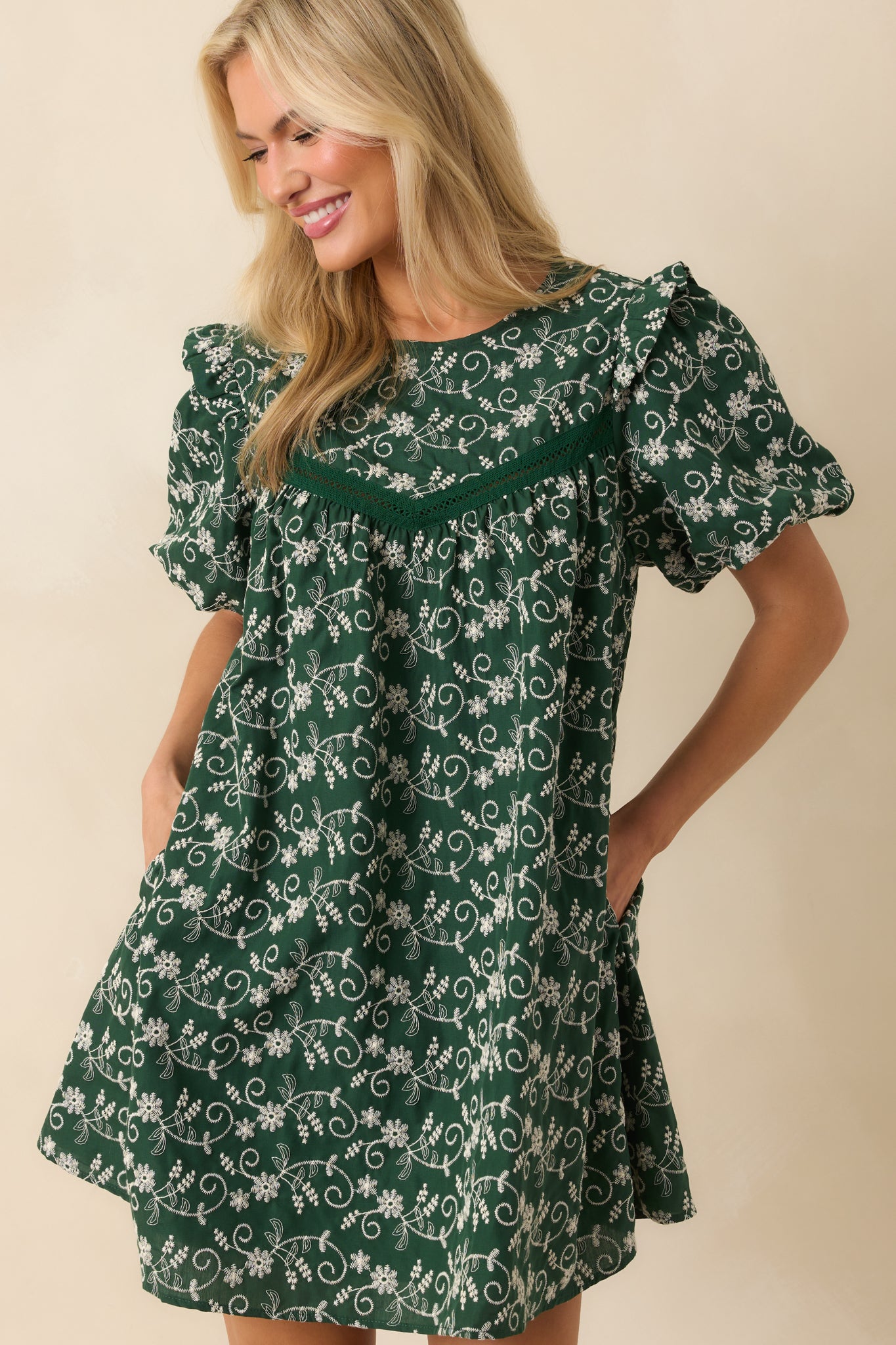 Cropped view emphasizing the upper section of the dress, showing puff sleeves and lace trim.