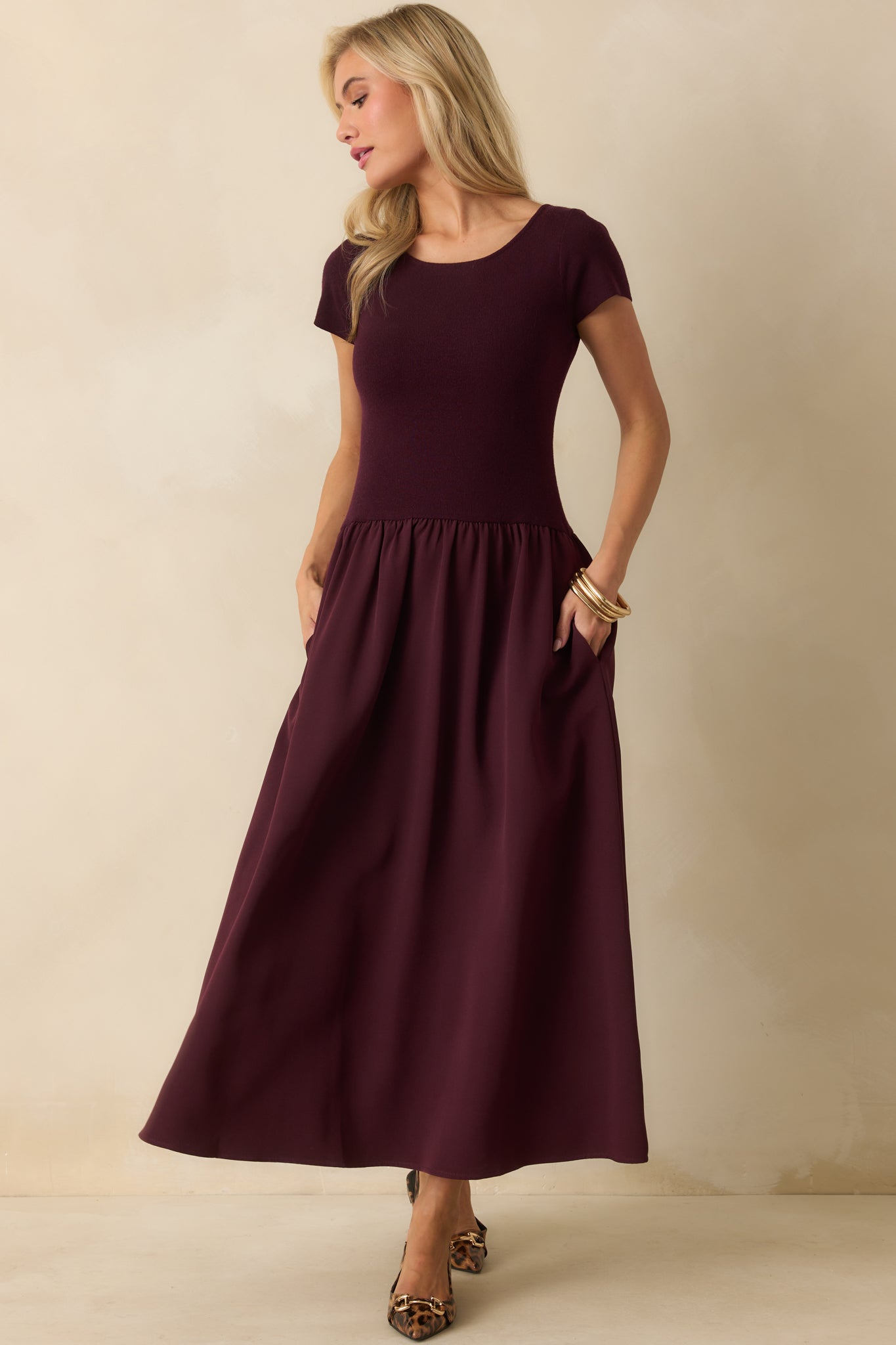 Elegant wine red dress featuring functional side pockets and a relaxed A-line fit.