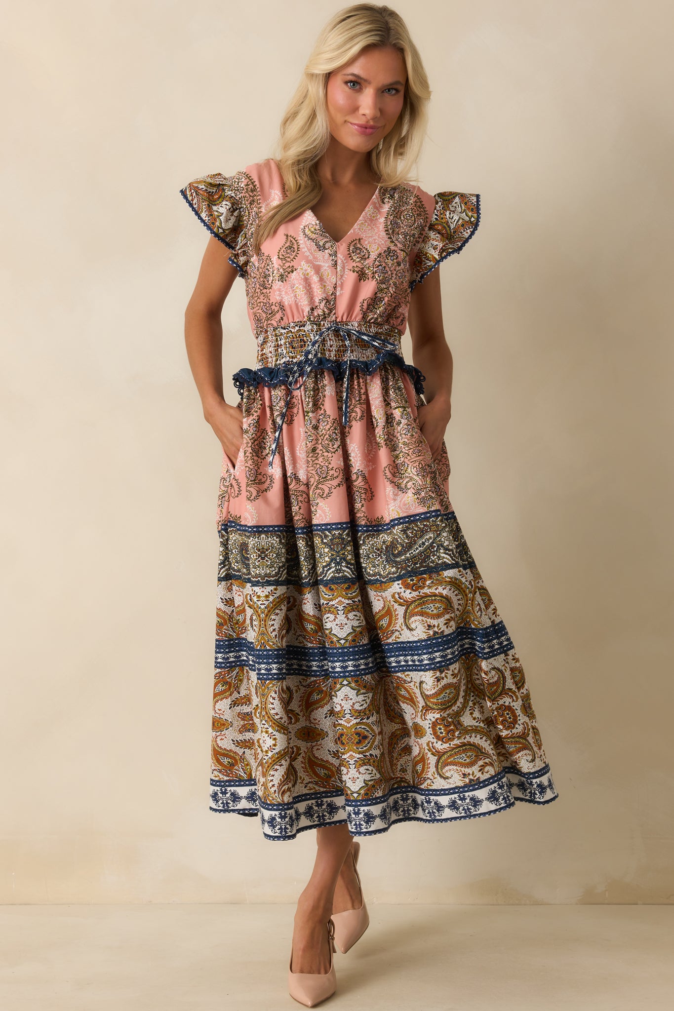 Flowing gathered skirt with paisley border print and contrast ruffle trim at the waist.