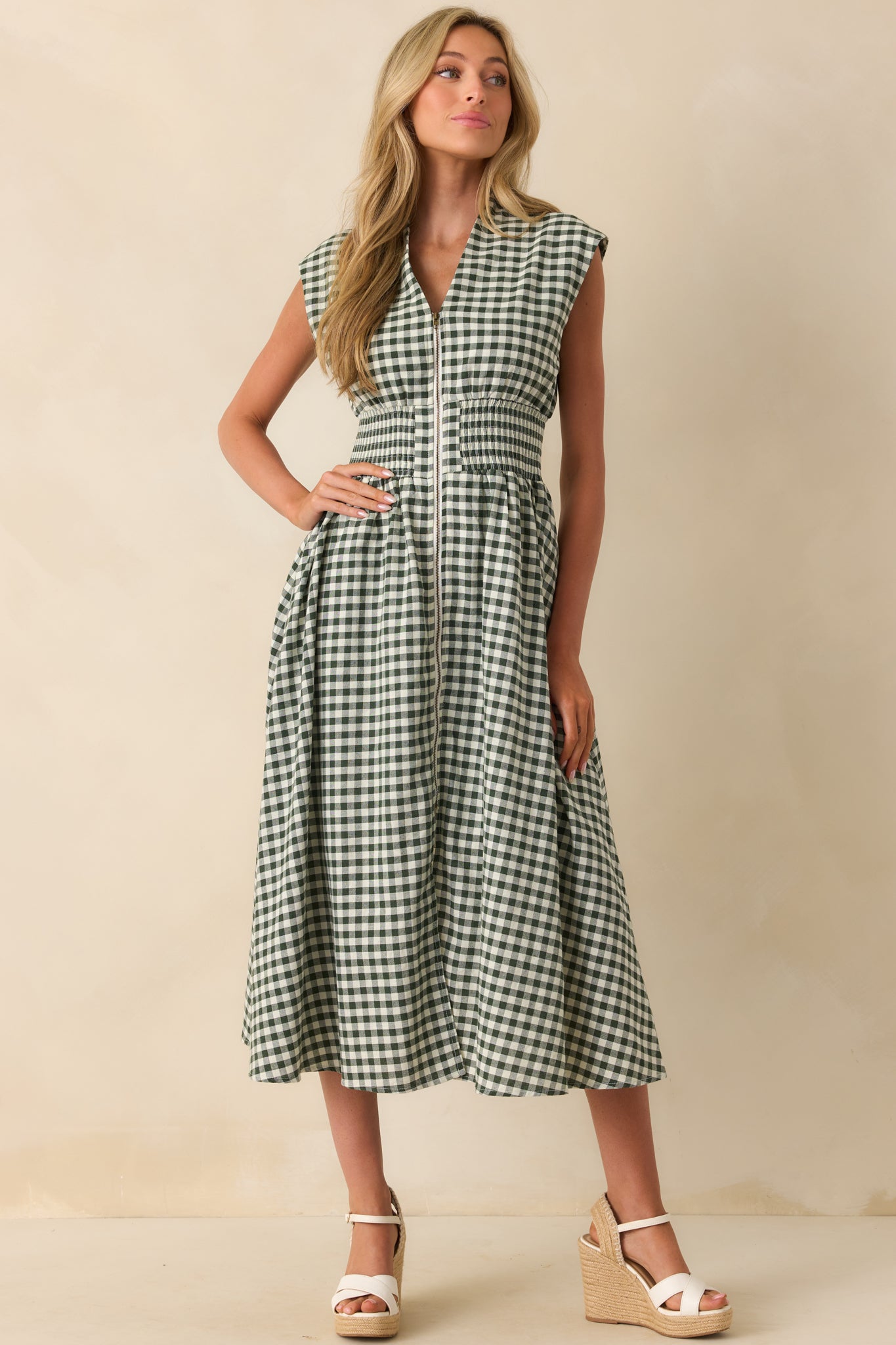 Green gingham midi dress with a v-neckline, padded shoulders, and capped sleeves shown in a full front view.