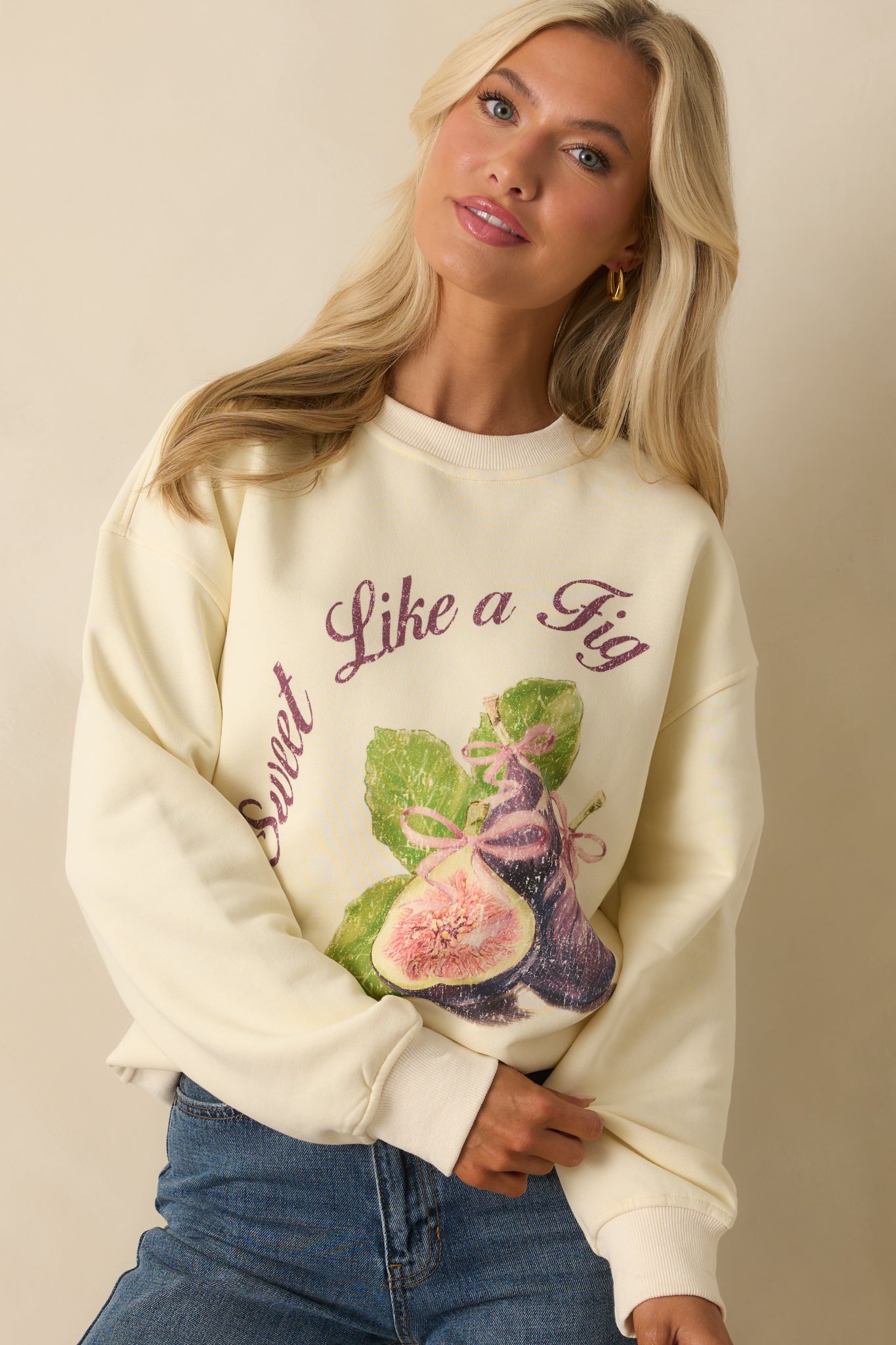 Front torso view of ivory sweatshirt with relaxed shoulders and vintage-inspired fig motif.