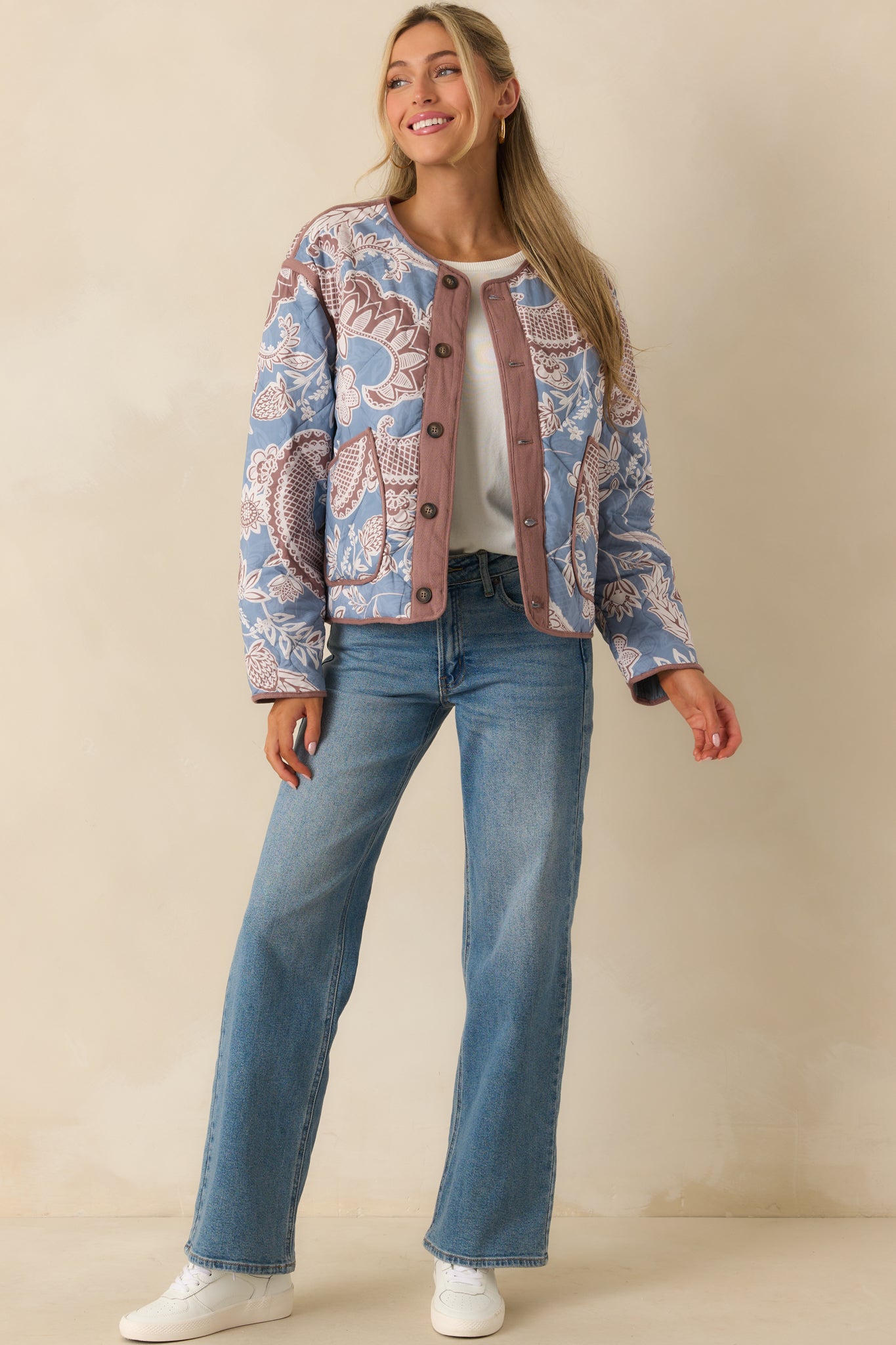 Jacket shown front facing, highlighting the round neckline, mauve trim details, and front patch pockets.