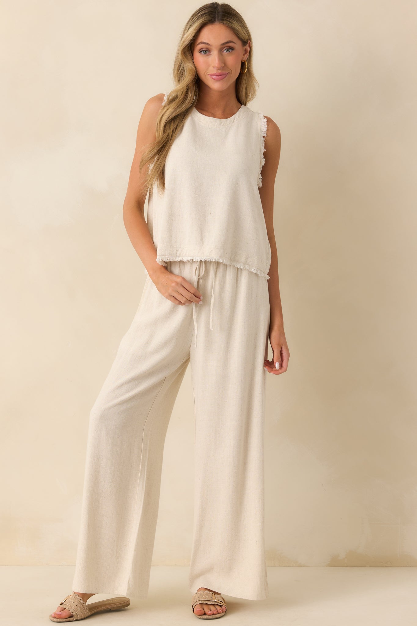 Front view of the sandstone pants highlighting the high waisted fit and wide leg silhouette.