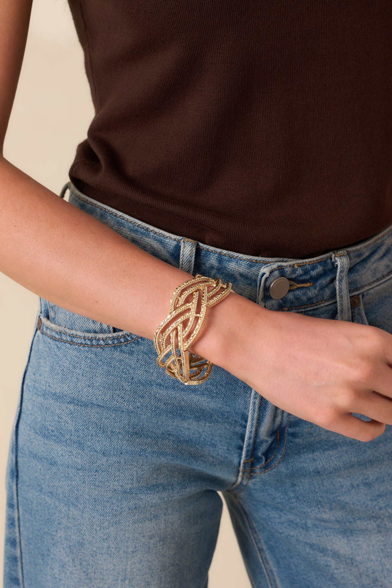 Angled cropped shot showing the slip-on opening and the dimensional twist of the braided pattern.