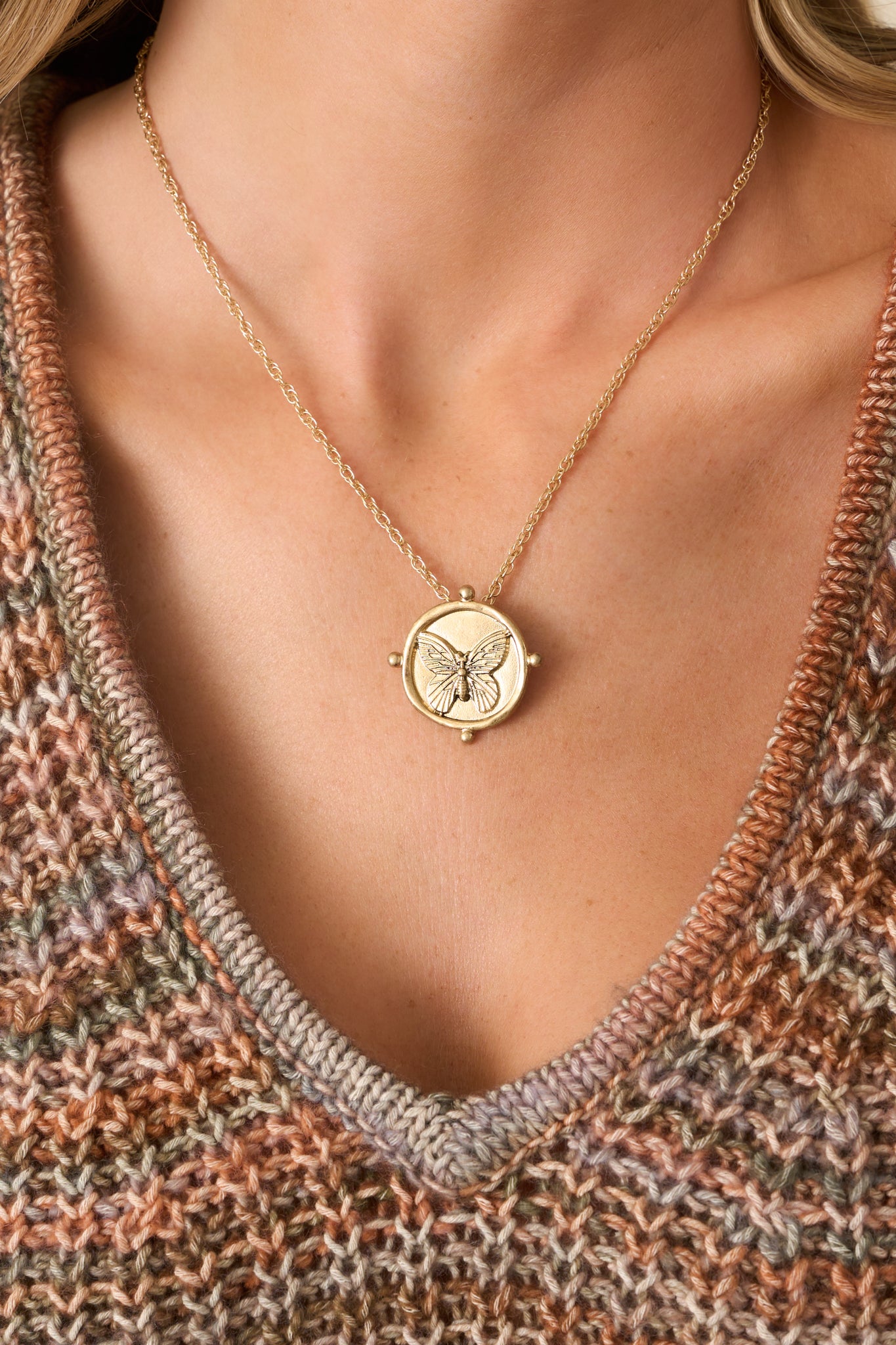 Cropped shot highlighting the delicate cable chain and part of the lobster clasp closure