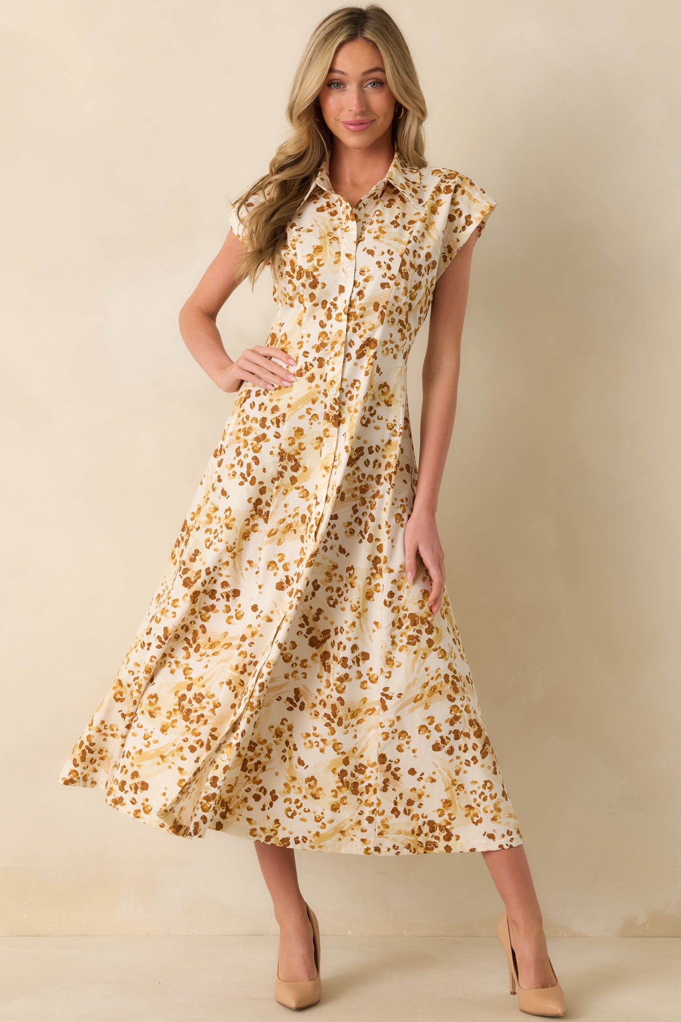 Golden yellow maxi dress showcasing pleated waist detail and button front closure
