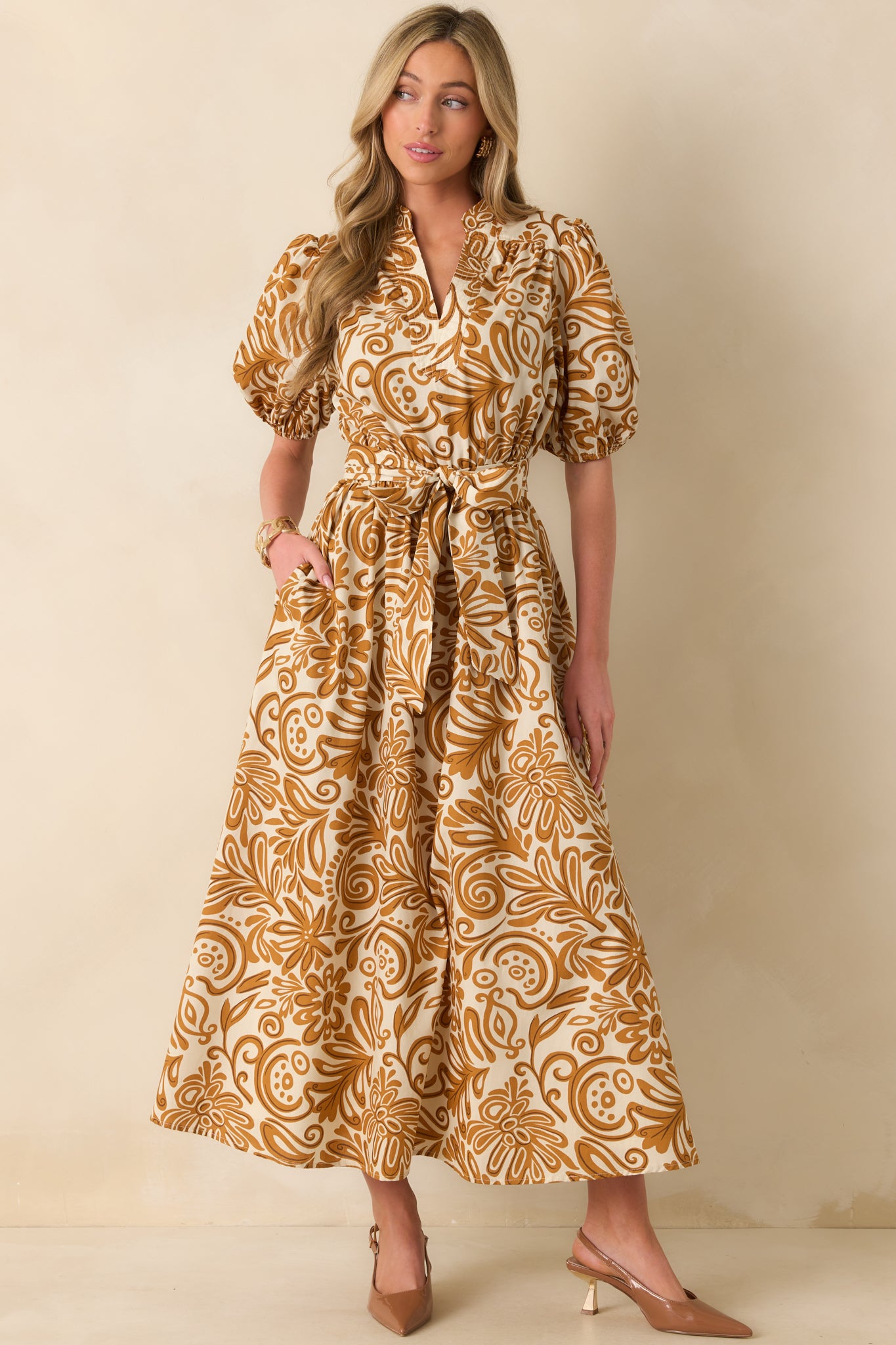 Golden yellow print maxi dress showcasing full ivory lining and a flowing ankle-length hem.