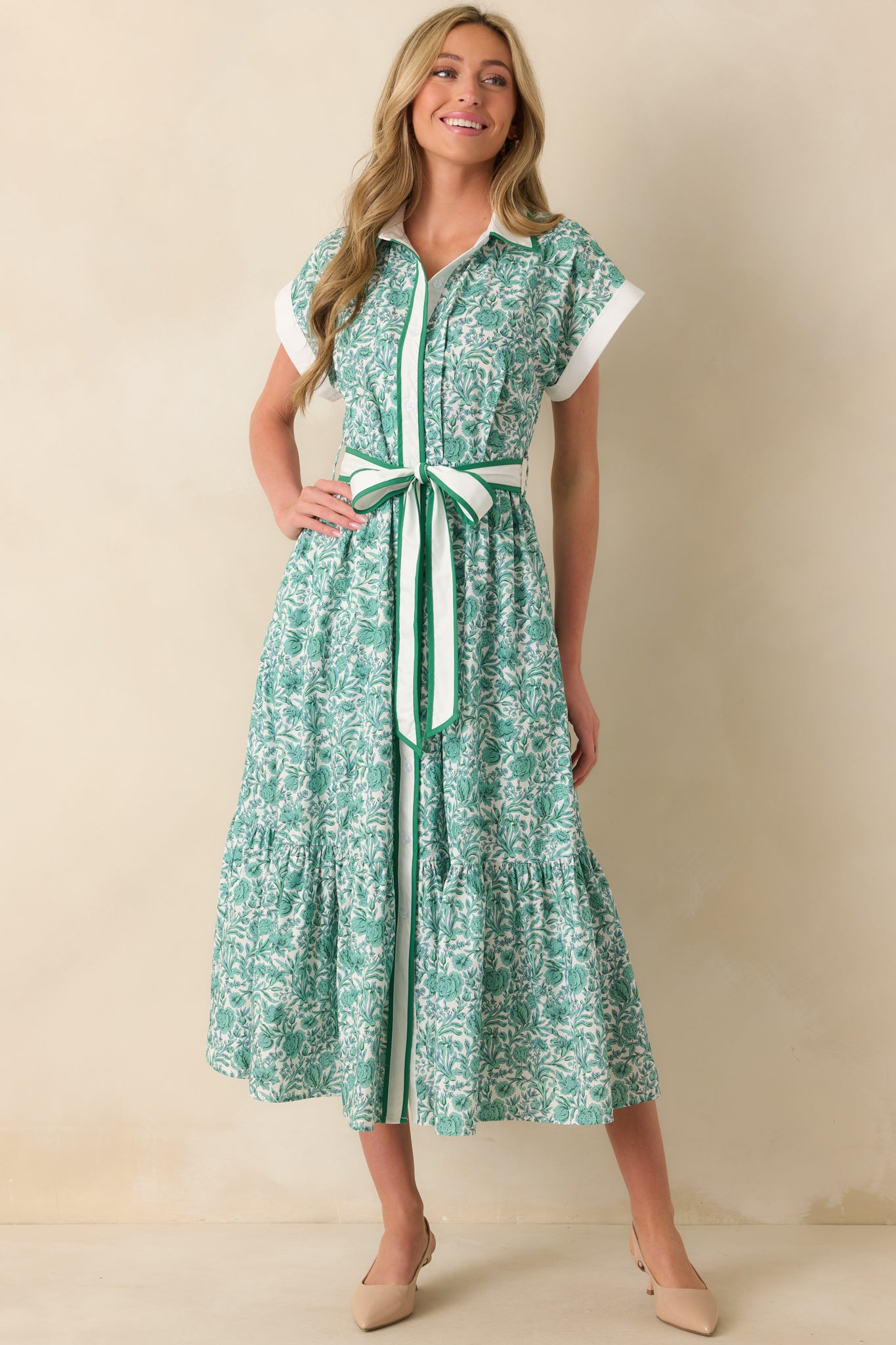 Green floral midi dress with short sleeves and a defined waist from the optional tie belt displayed in a full front view.