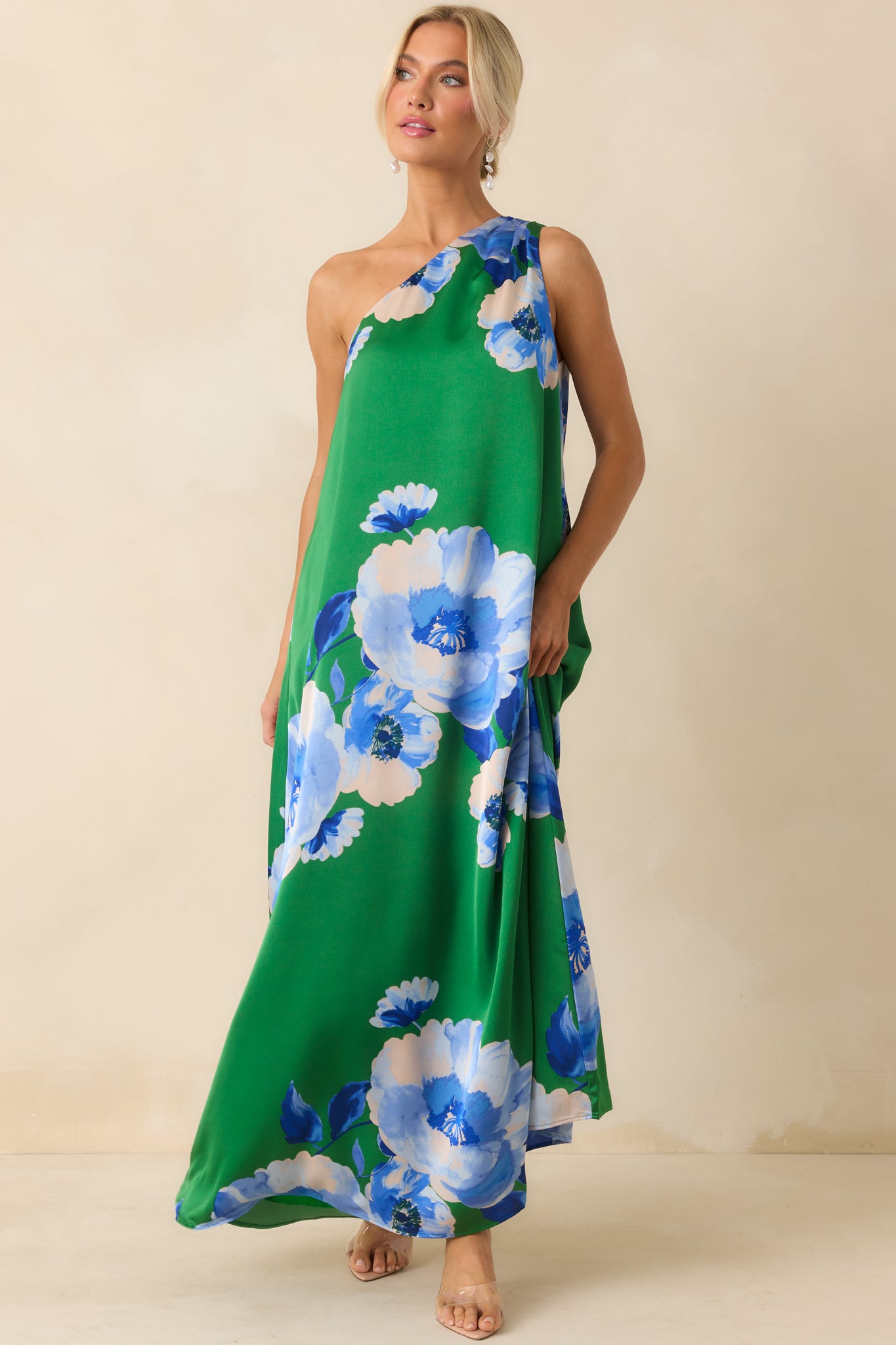 A front body image highlighting the fluid movement of the flowy satin fabric and the dress’s overall silhouette.
