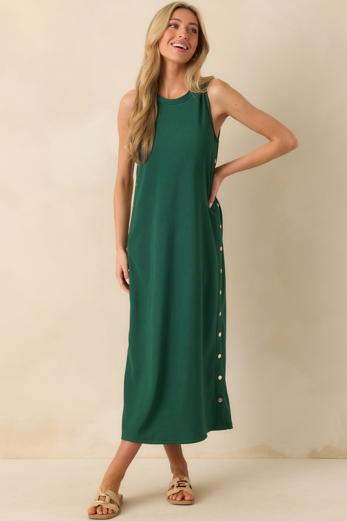 Full body front view of the green maxi dress featuring a crew neckline and sleeveless design.