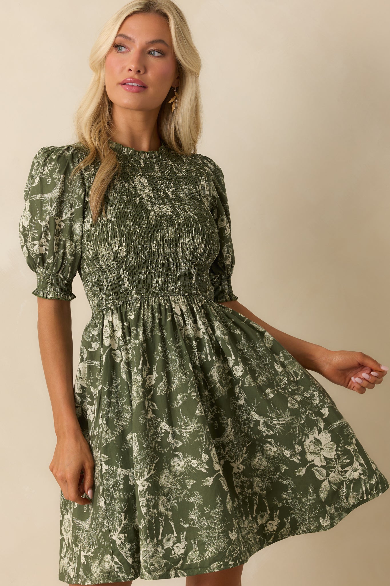 Functional side pocket detail on the green toile mini dress.