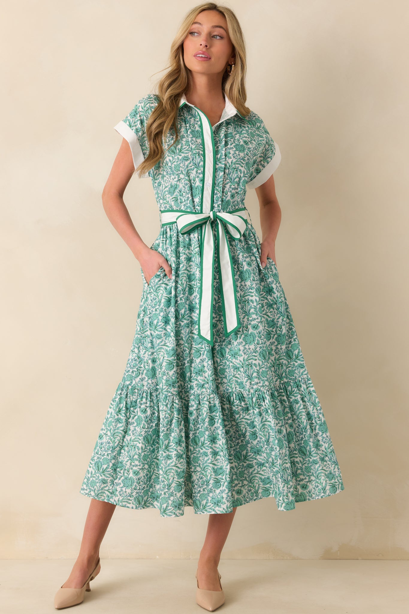 Green midi dress with multi-tone green floral print, white collar neckline, and button front closure shown in a full front view.