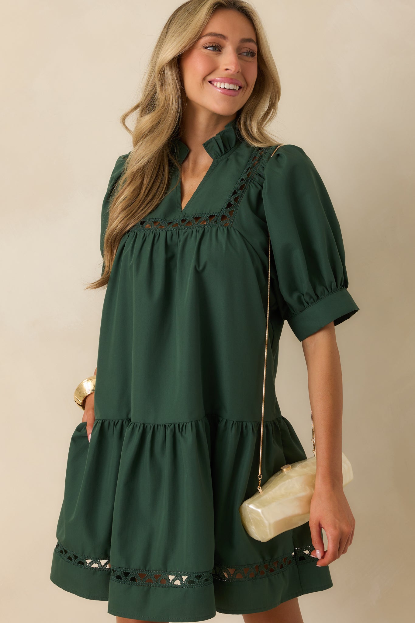 Hunter green fabric with ladder lace inserts adding soft detail to the design.