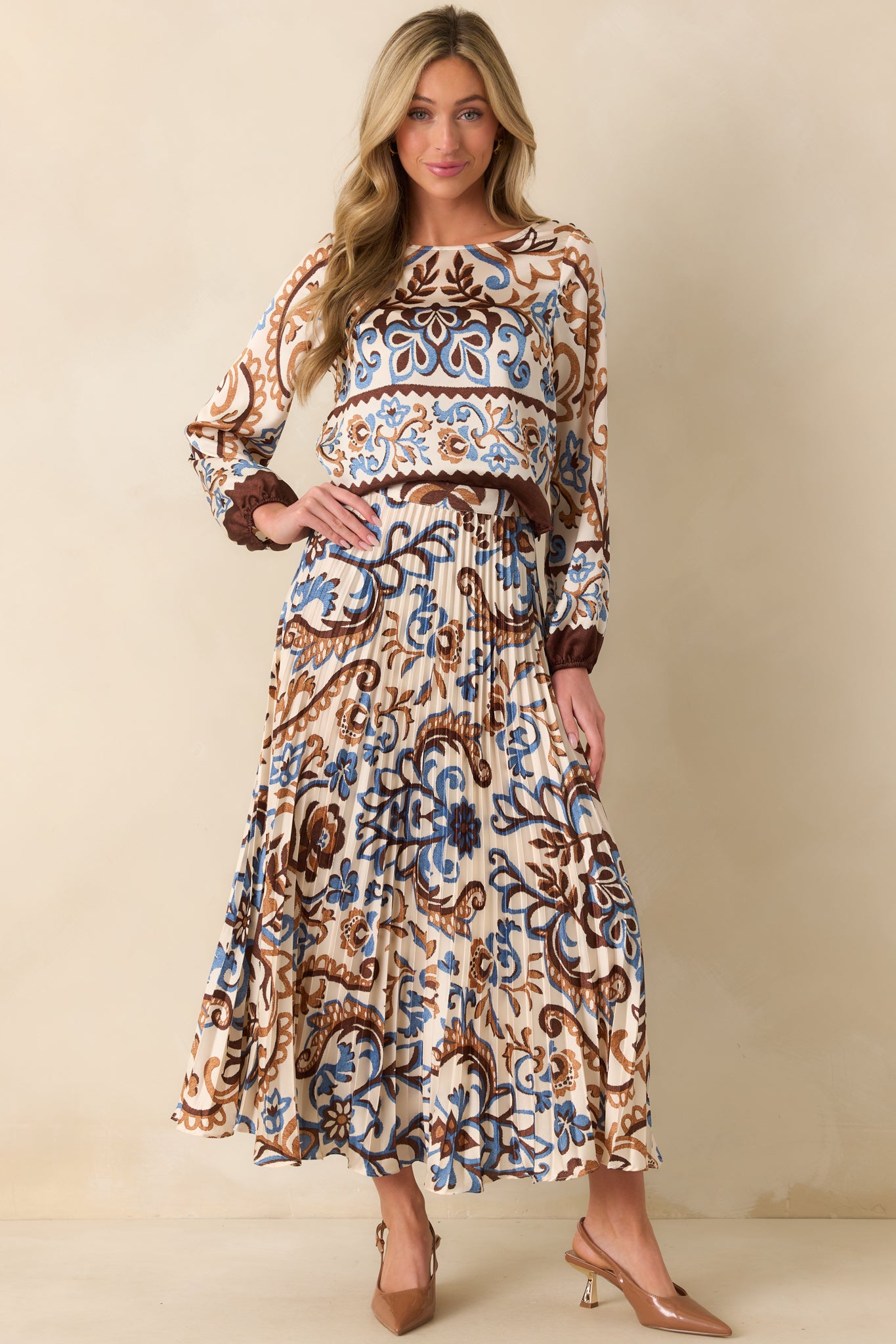 Front-facing shot highlighting the high rise waist and pleated design.