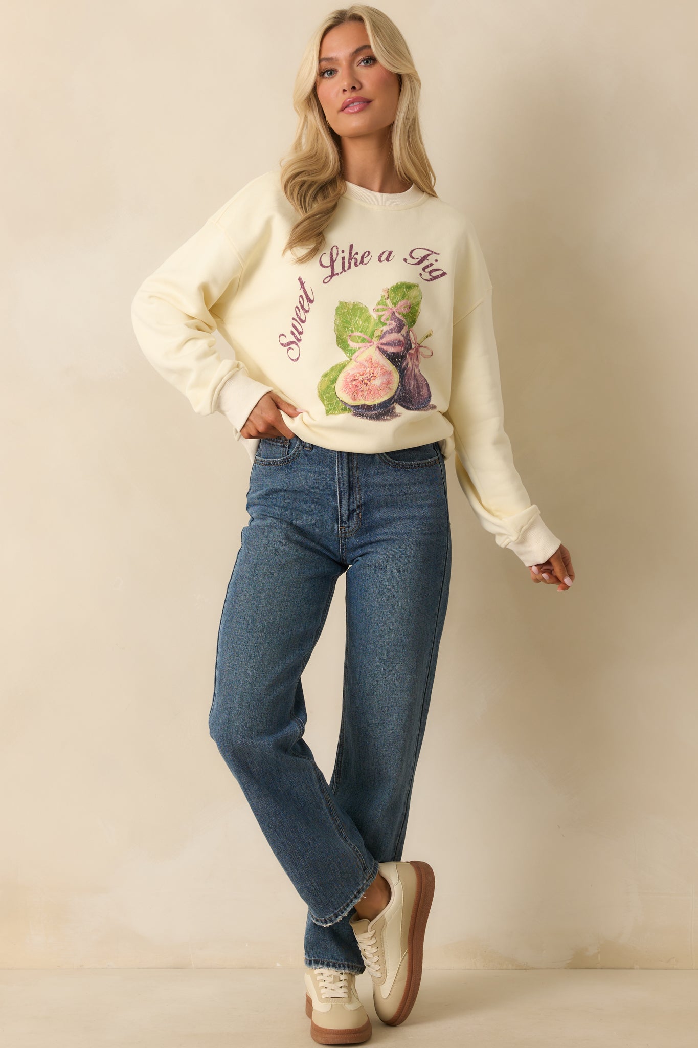 Ivory cotton sweatshirt with vintage-style 'Sweet Like A Fig' graphic, shown in a relaxed full front view.