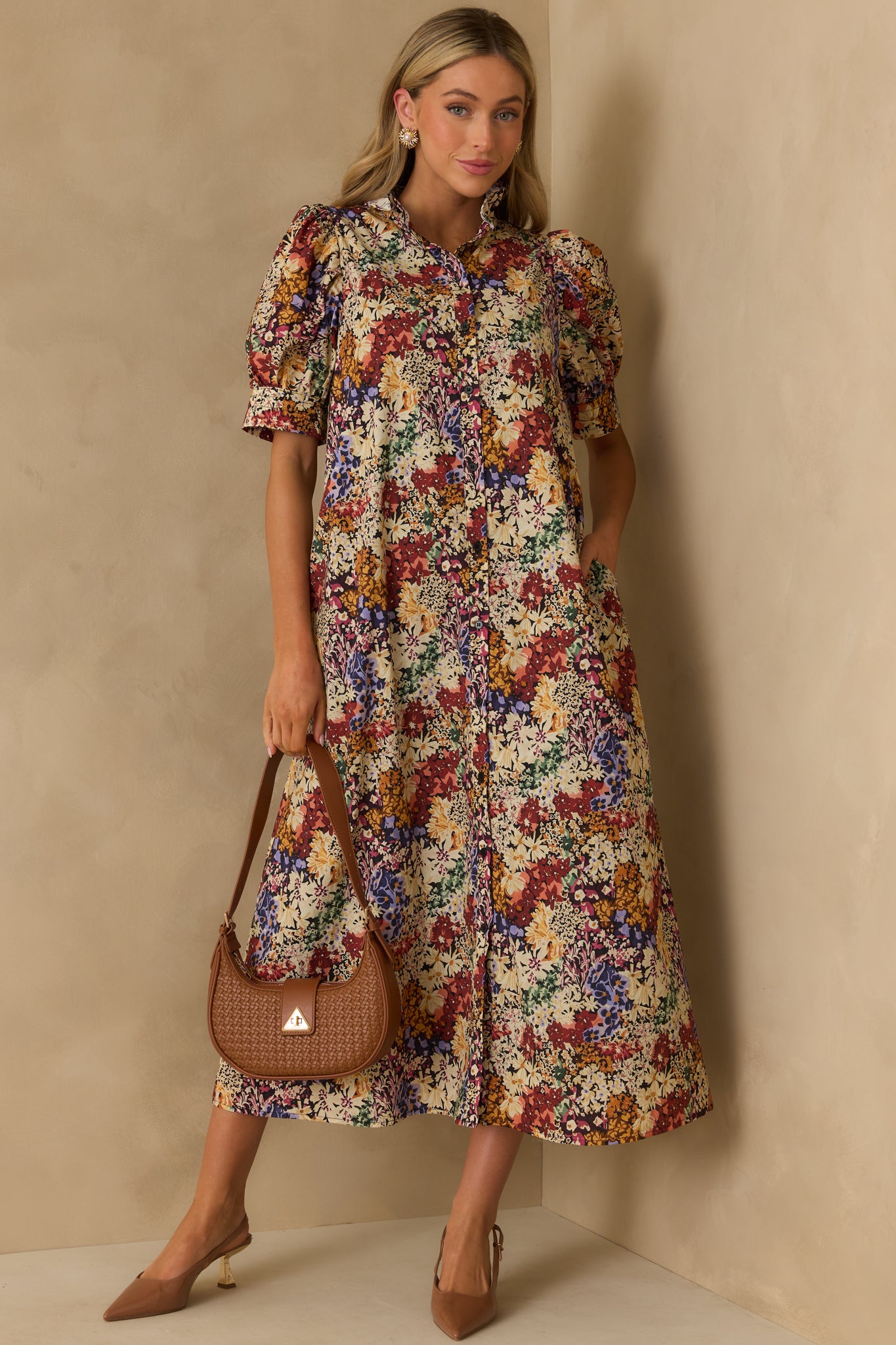 Light and airy ivory maxi dress with button front closure, puff sleeves, and a casual, easygoing fit.