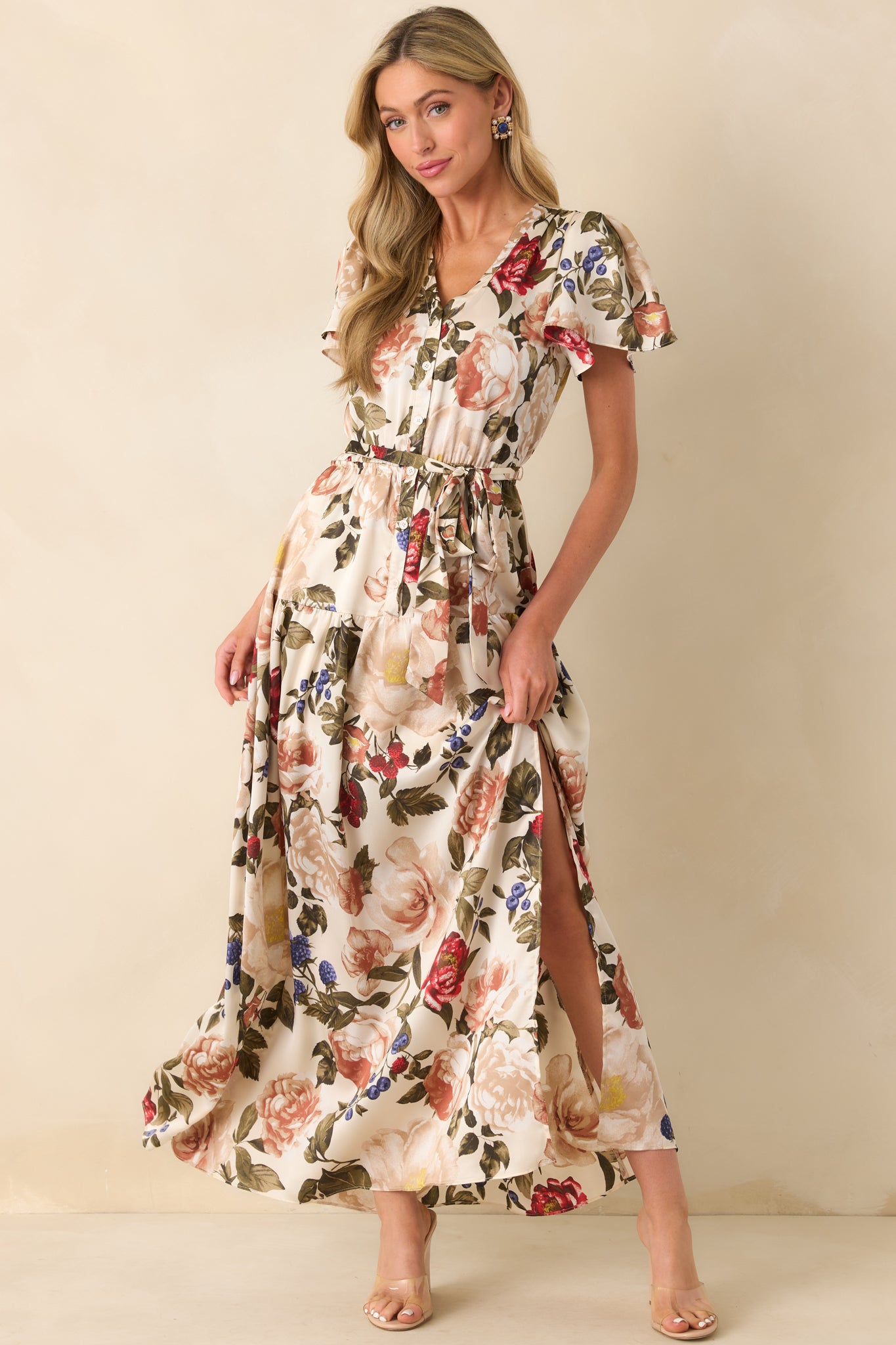 A front full length photo showing the functional button front bodice and flowing skirt with a leg slit.