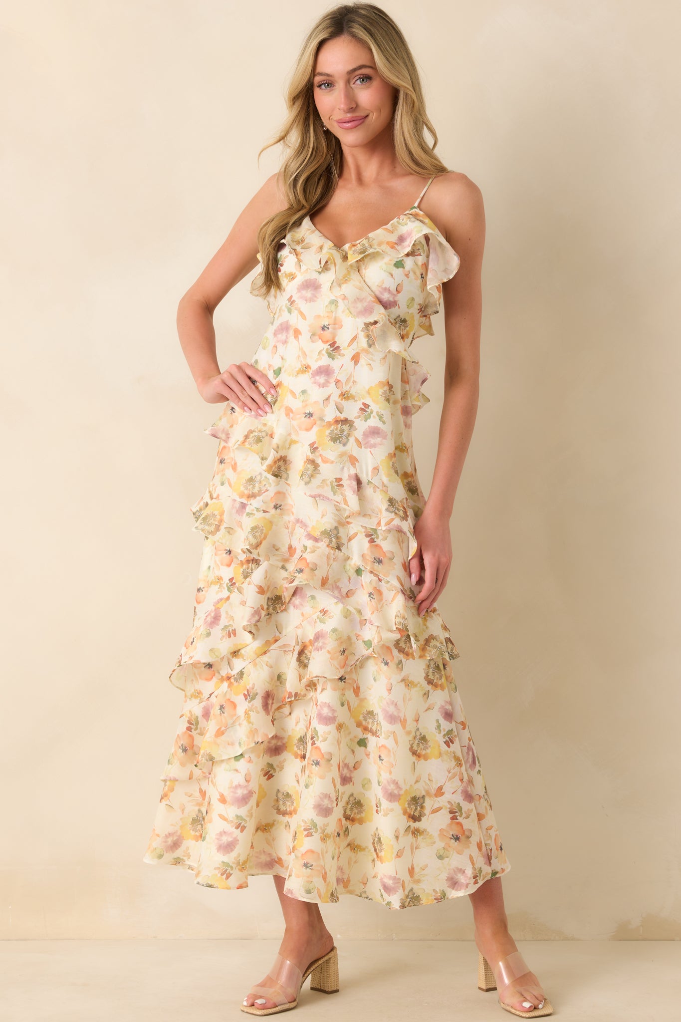 A posed shot highlighting the chiffon overlay and large ruffle detailing down the skirt.