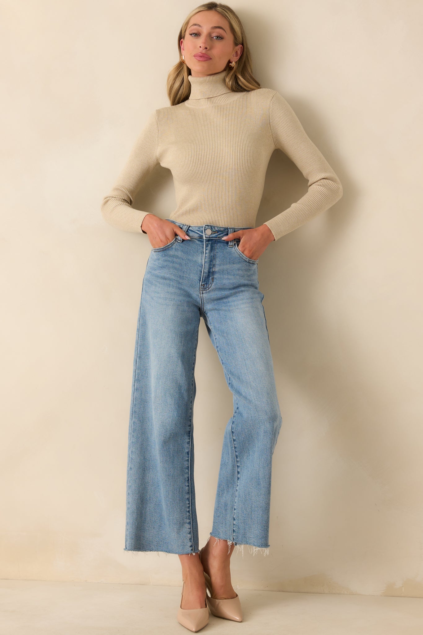 Full body front view of the khaki sweater showcasing its ribbed texture and classic turtleneck design.