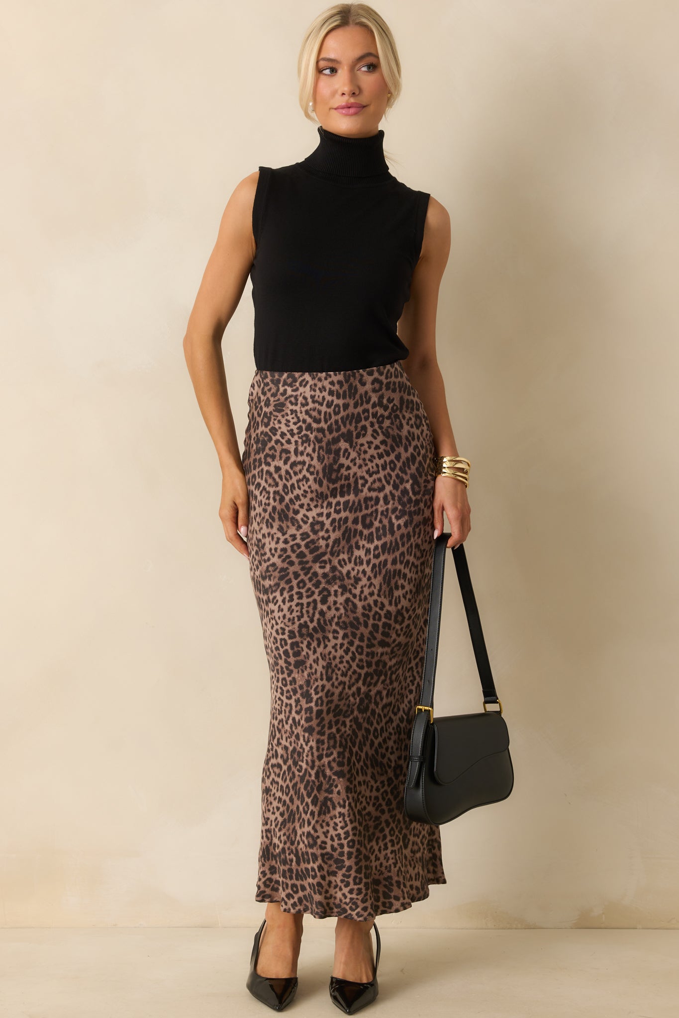 A full front view of the leopard print maxi skirt featuring a high-rise fit and bias-cut silhouette.