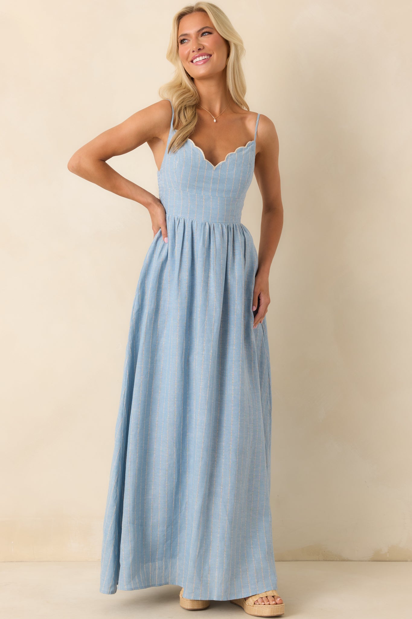 A front-facing photo highlighting the adjustable spaghetti straps and embroidered neckline.