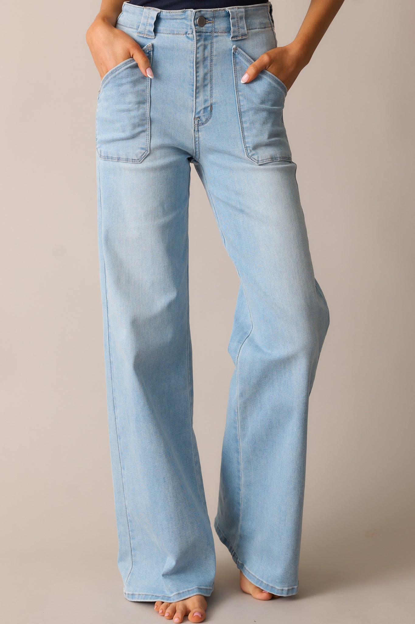 A detailed view of the jeans’ flared leg, showcasing the clean hemline, denim texture, and subtle seam details.