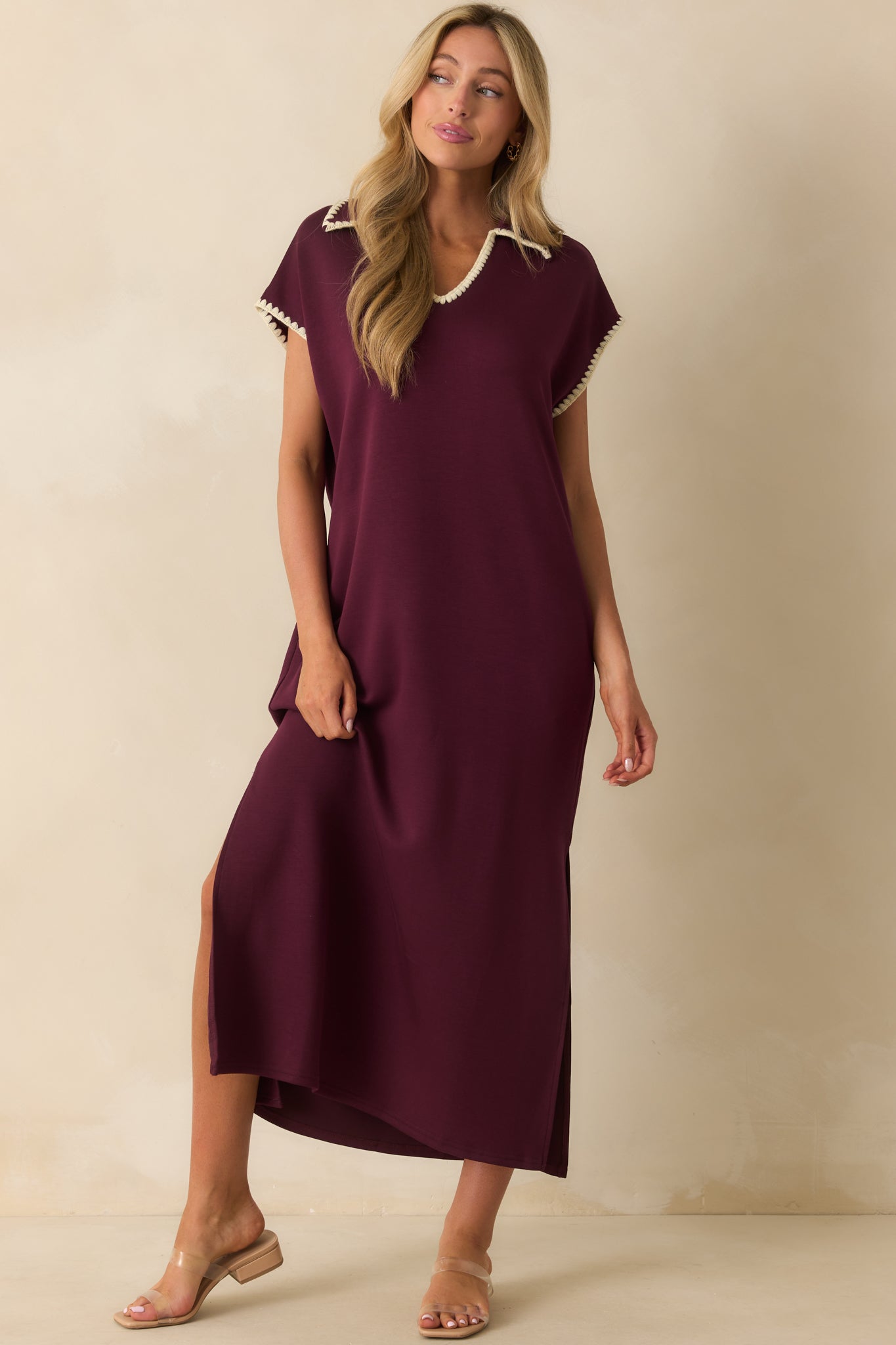 Maxi dress designed with contrast trim details, short sleeves, and a comfortable drape.