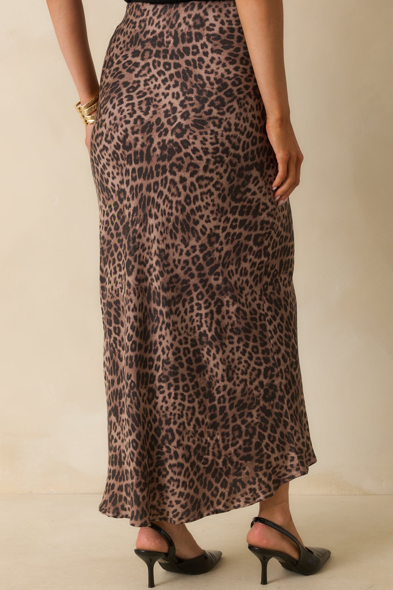A back view of the maxi skirt showing the bias-cut silhouette and elastic waistband.