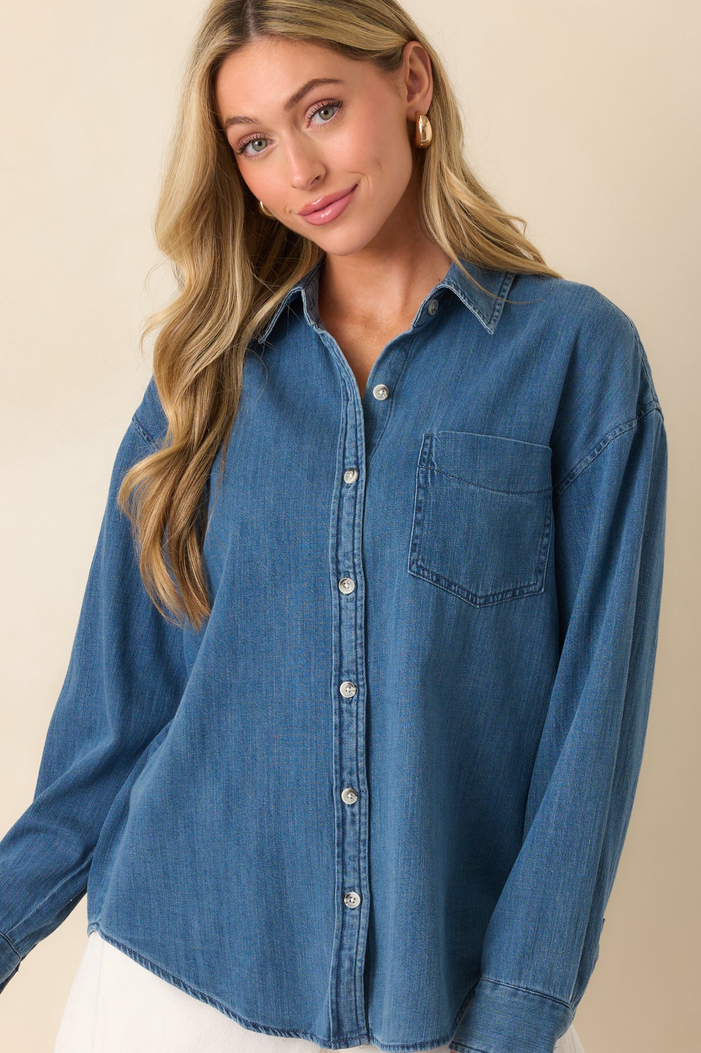 Cropped front view showing the collar, top buttons, and upper section of the functional breast pocket.