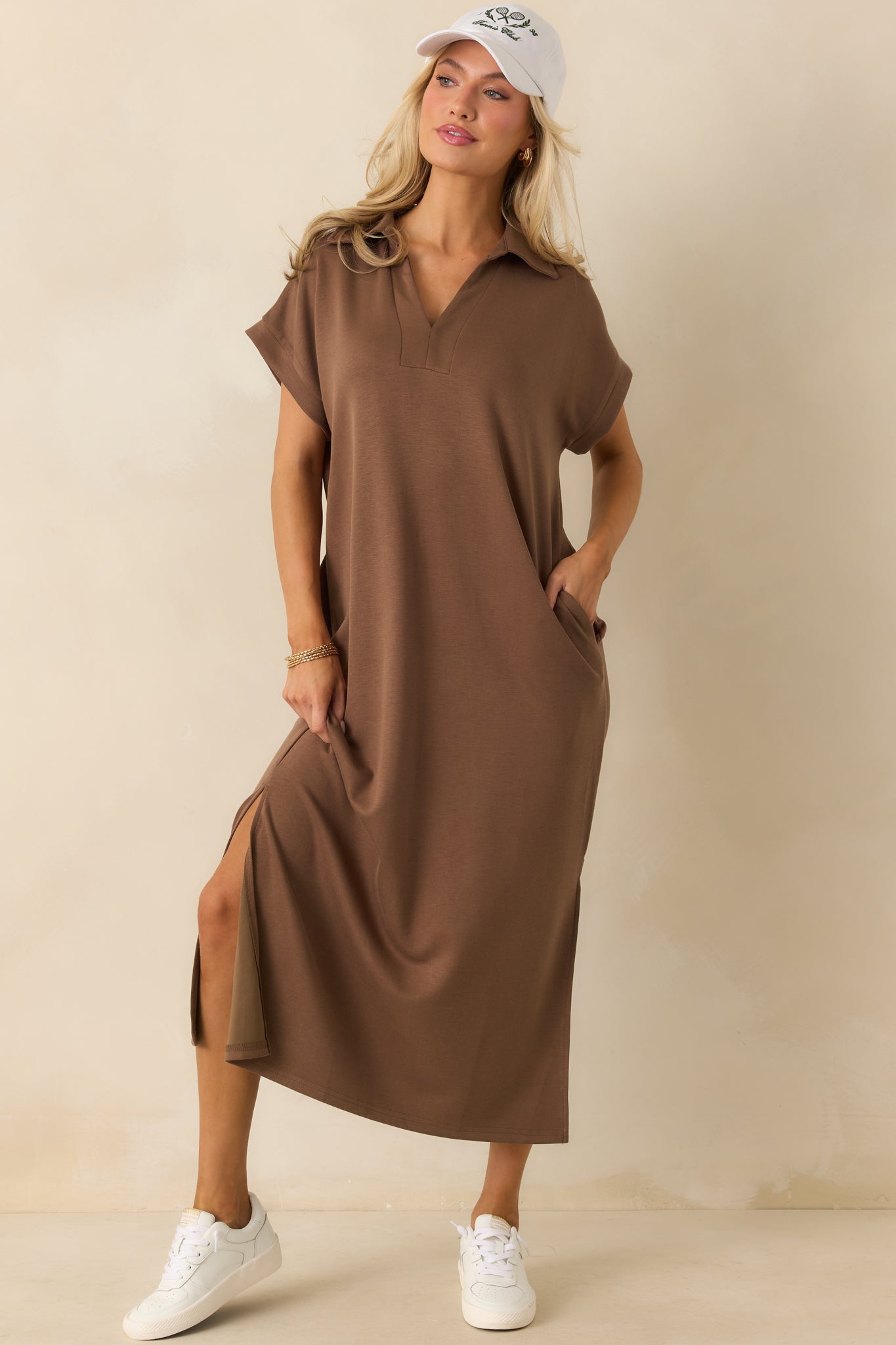 Soft, buttery fabric midi dress in mocha brown, styled with short sleeves, a notch collar, and discreet side vent leg openings.