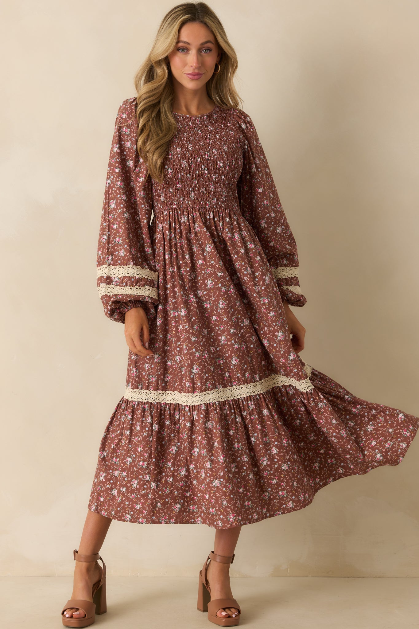 Multicolor floral dress with a relaxed tiered skirt and romantic smocked top for a flattering fit.