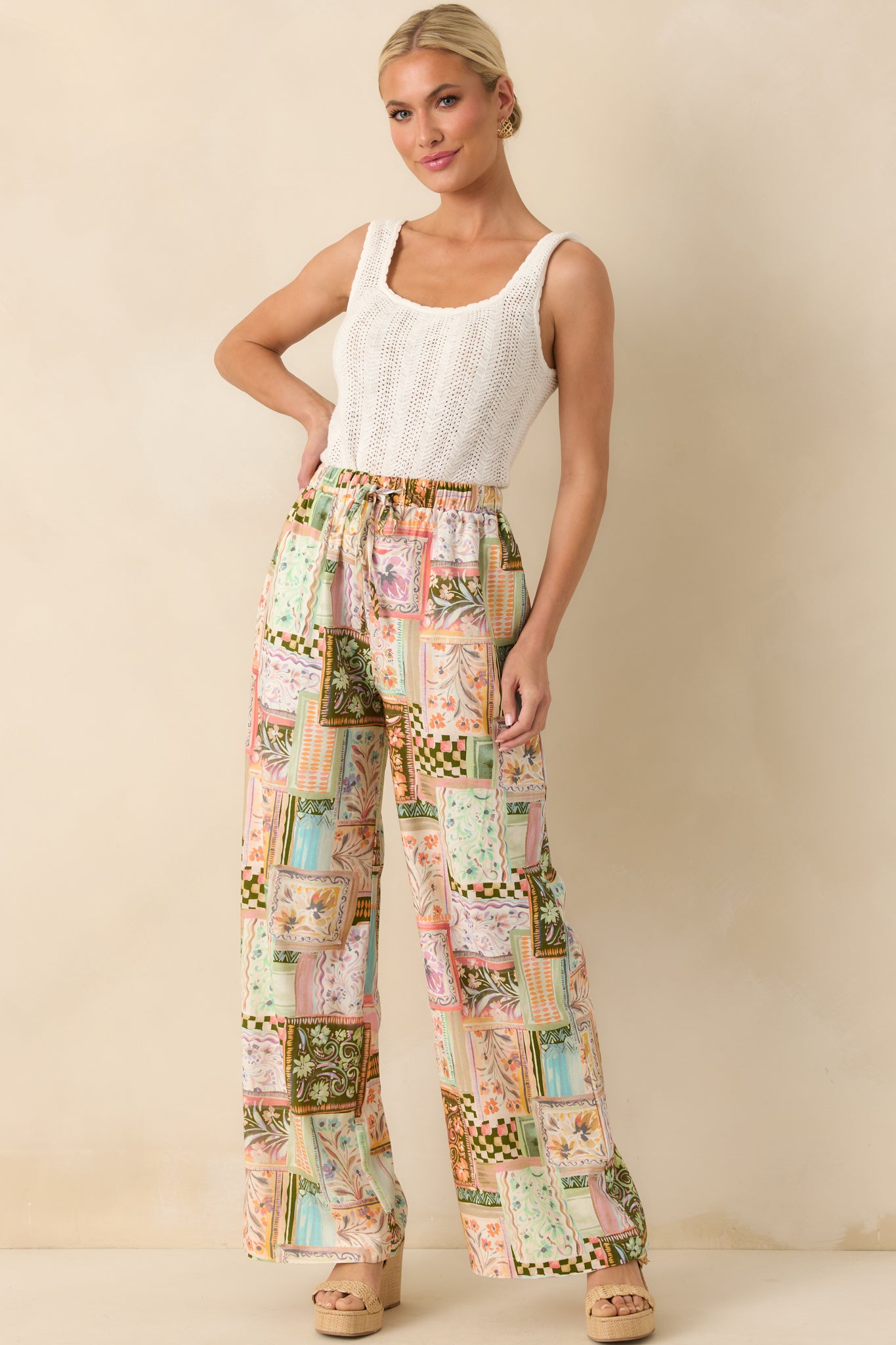 Full body view highlighting the flowy wide leg design and adjustable drawstring waistband of the patchwork pants.