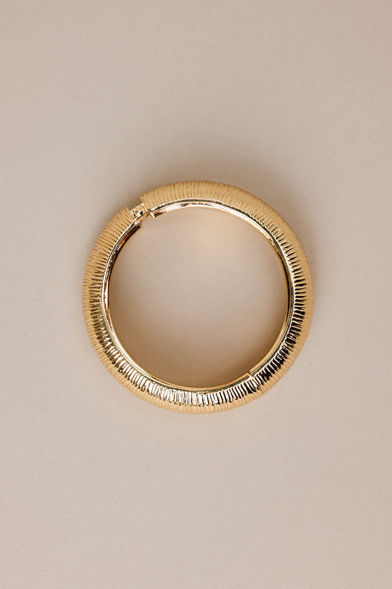 A tight close-up of the hinge and texture, highlighting the intricate etching and precision of the closure.