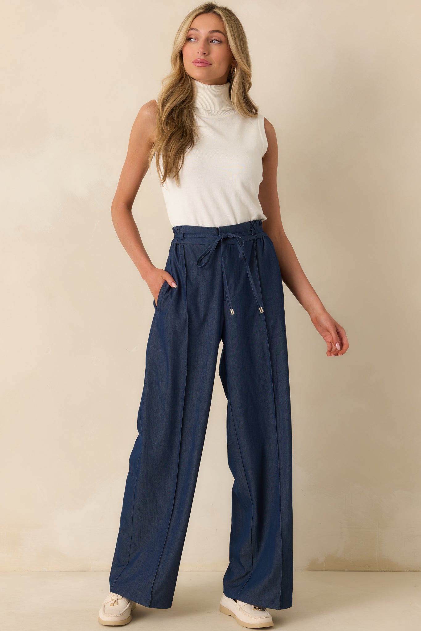 Straight-on full body image emphasizing the center leg seam details and overall fit.