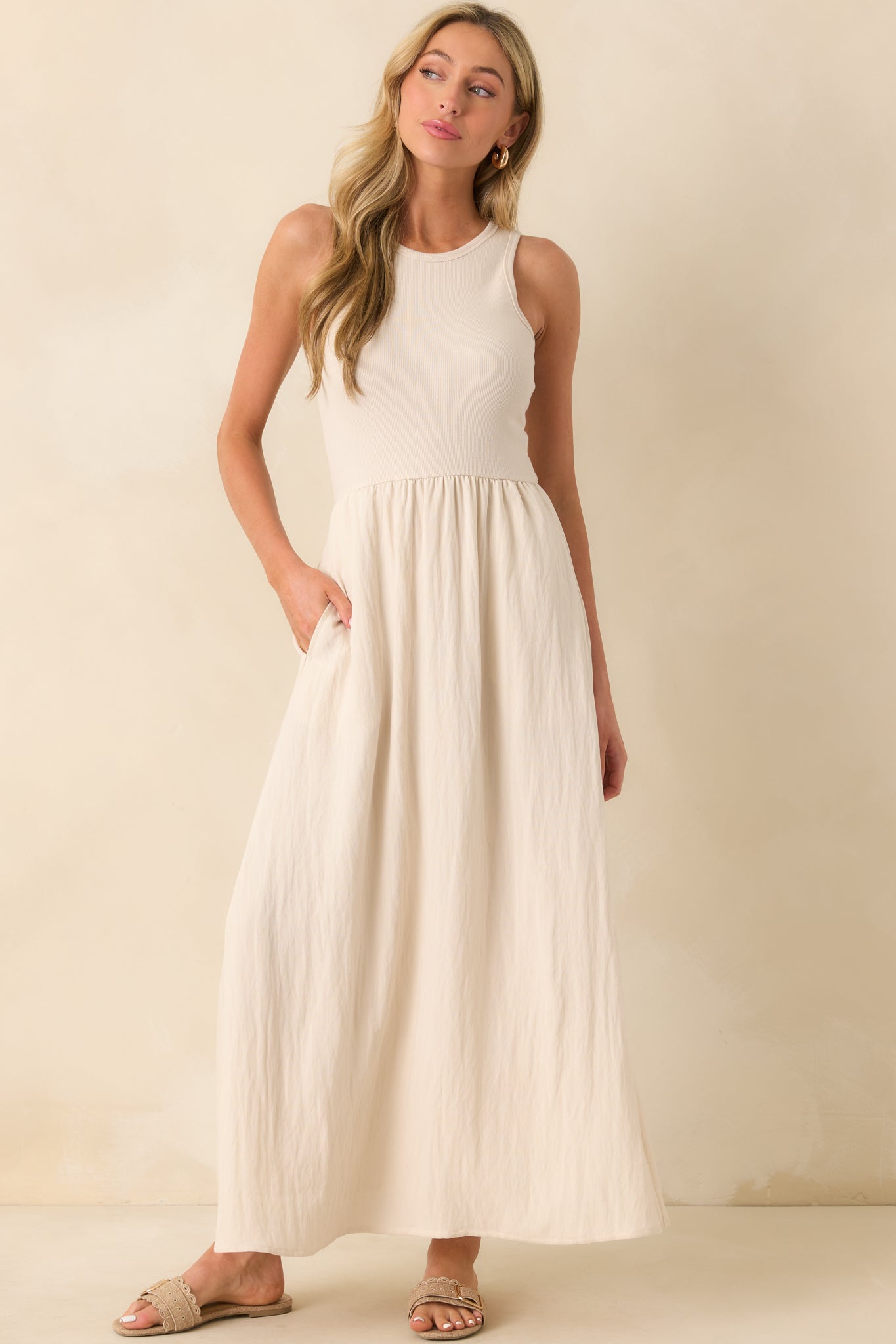 Full body photo showcasing the fitted ribbed top and the soft volume of the textured skirt in a front-facing pose.