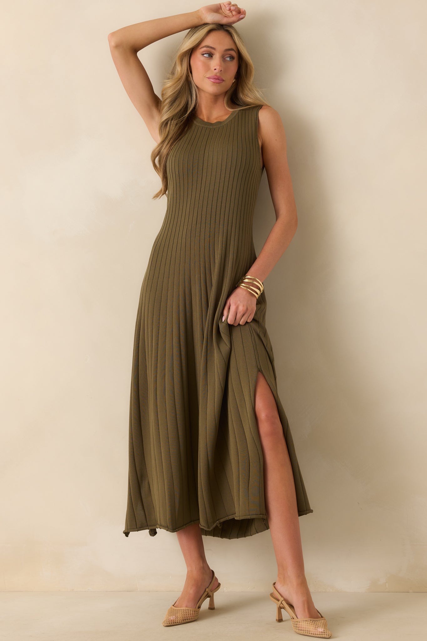 Olive green midi dress with ribbed knit fabric, round neckline, and rolled bottom hem.