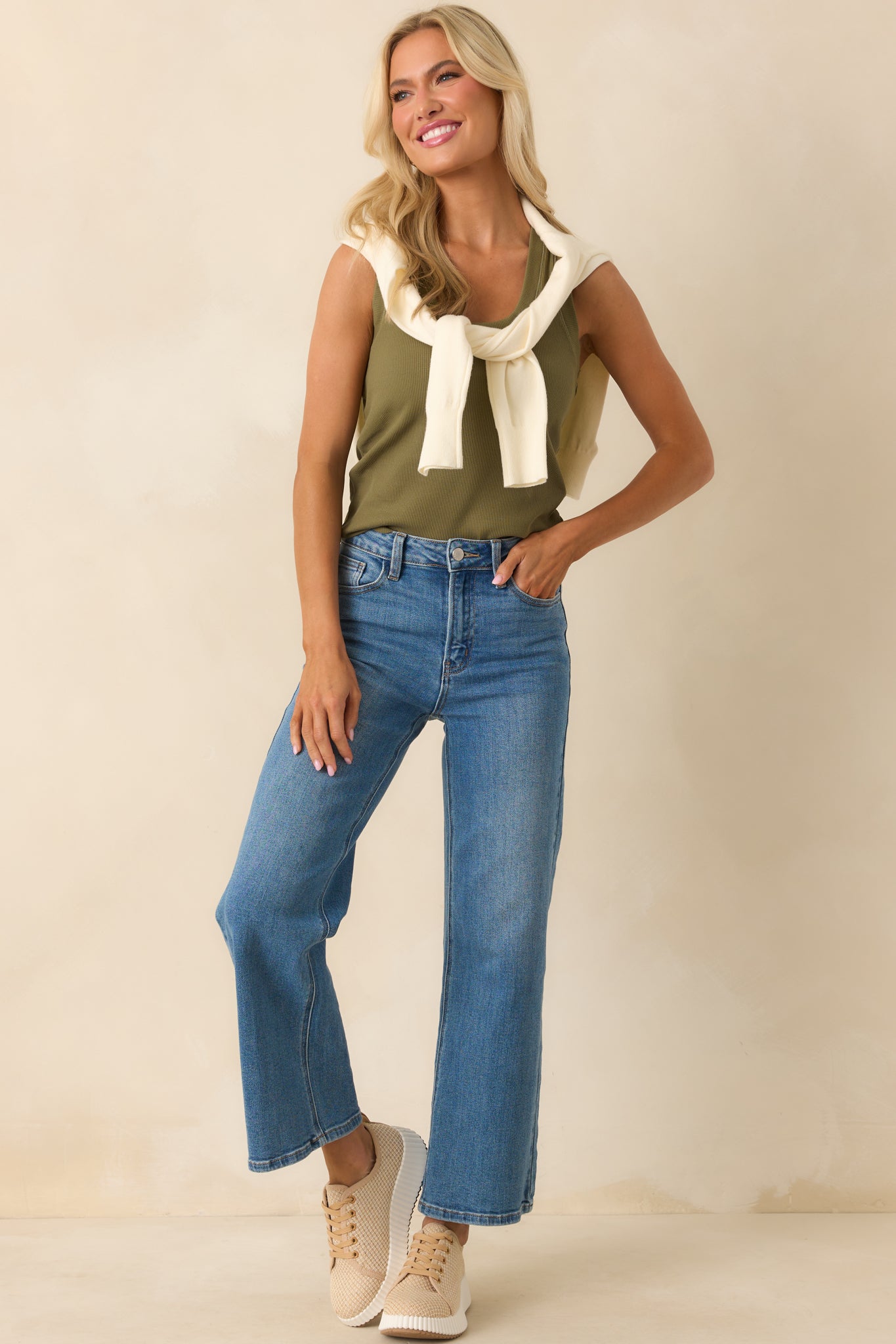 Full body view capturing the clean, minimal design and how the cropped length meets the waist.