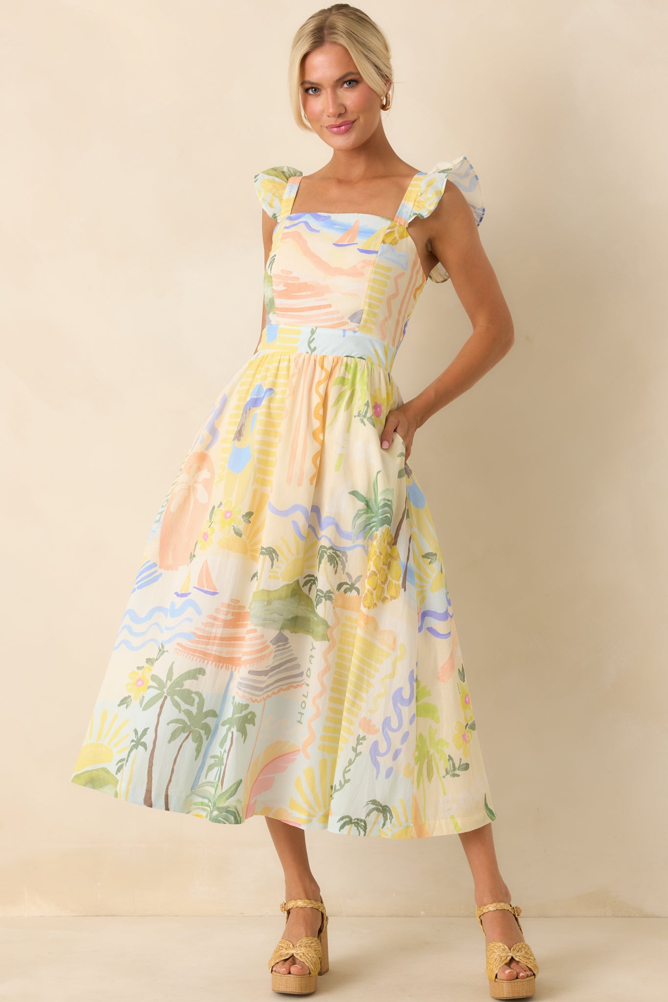 Full body of exclusive Prosperina "Citrus Splash" multicolor print. Dress features a square neckline, flutter sleeves, smocked back panel, hidden back zipper closure, full white lining, and functional pockets.
