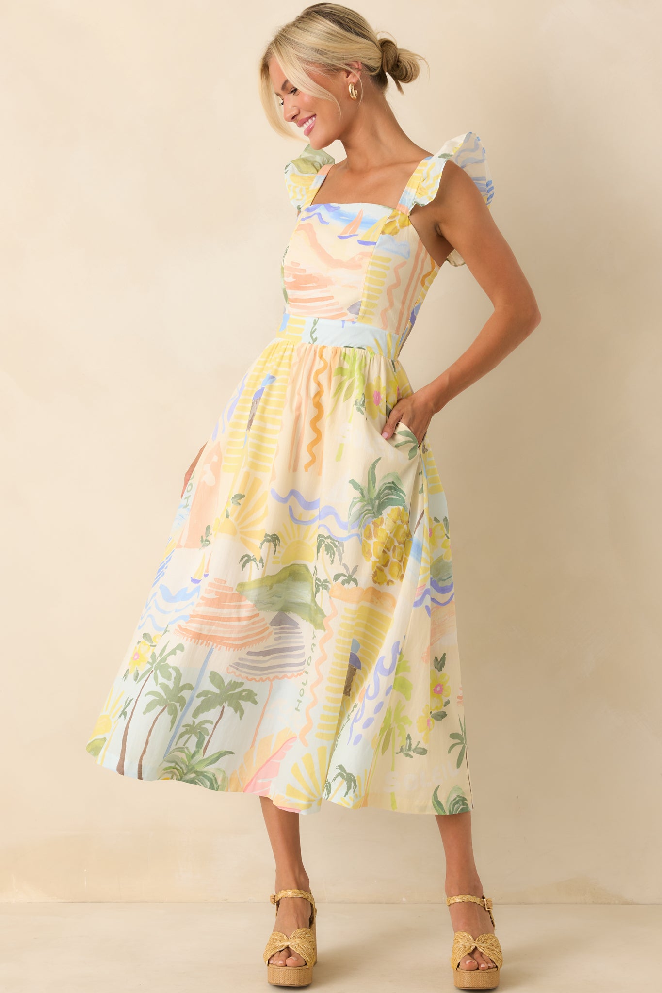 Full body of exclusive Prosperina tropical print, square neckline, flutter sleeves, and functional pockets.