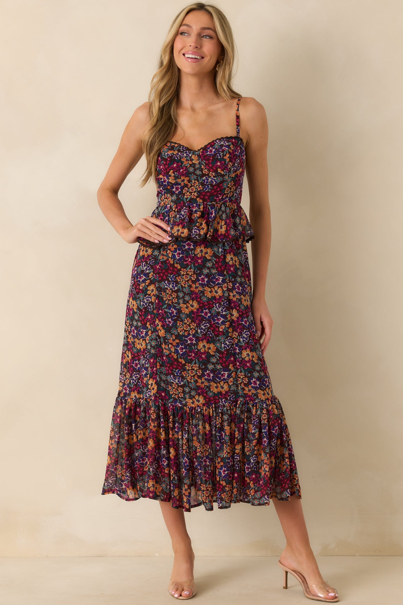 Front view of plum purple maxi dress with multicolor print, sweetheart neckline, and adjustable spaghetti straps.