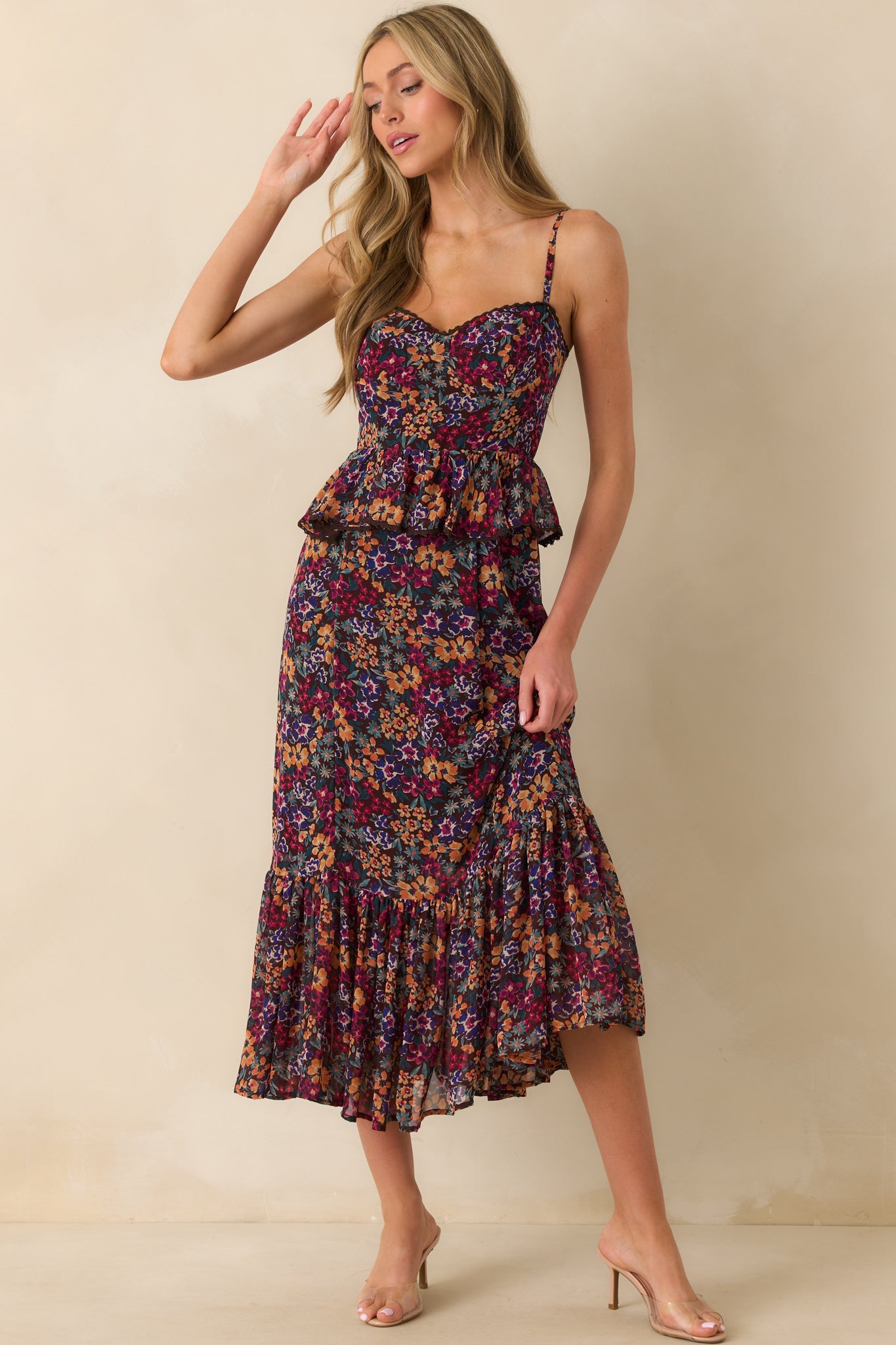 Front shot of plum maxi dress with adjustable straps, ruffled waist detail, and soft brown interior lining.