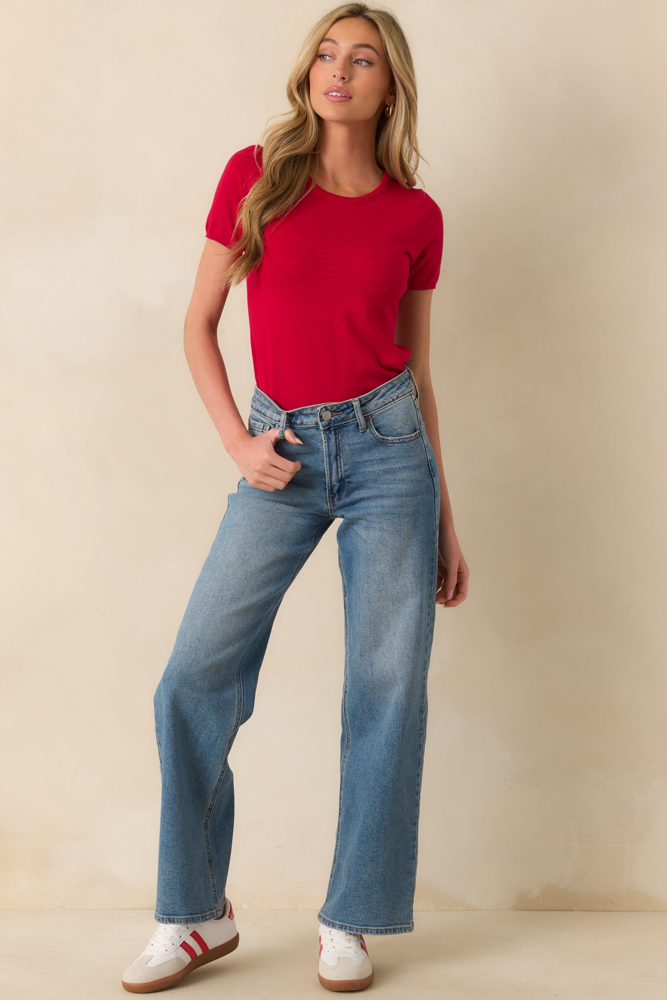 Another full length shot emphasizing the casual fit and clean lines of the red sweater top.