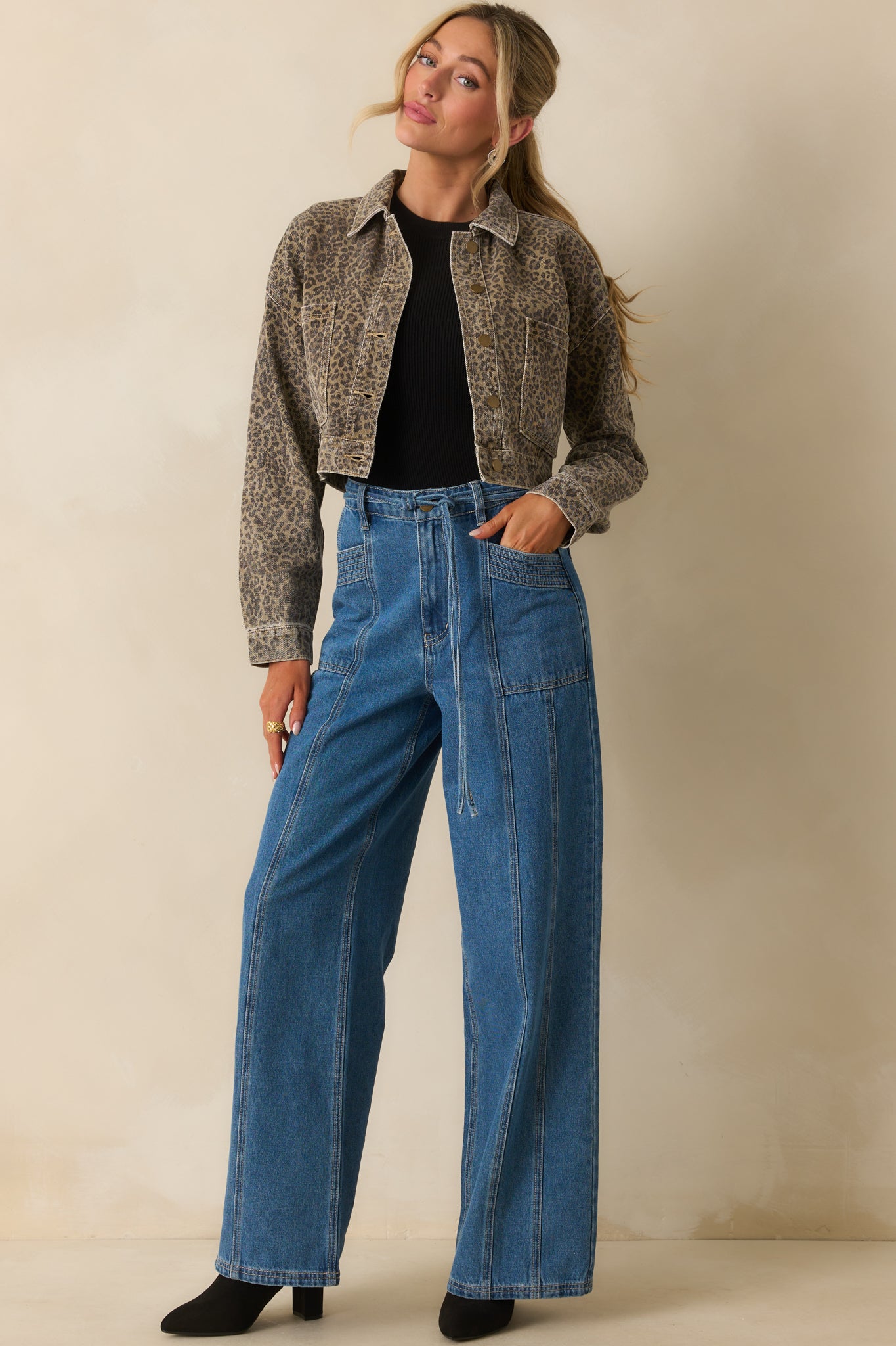Relaxed wide leg denim with a clean paneled construction and classic medium wash.