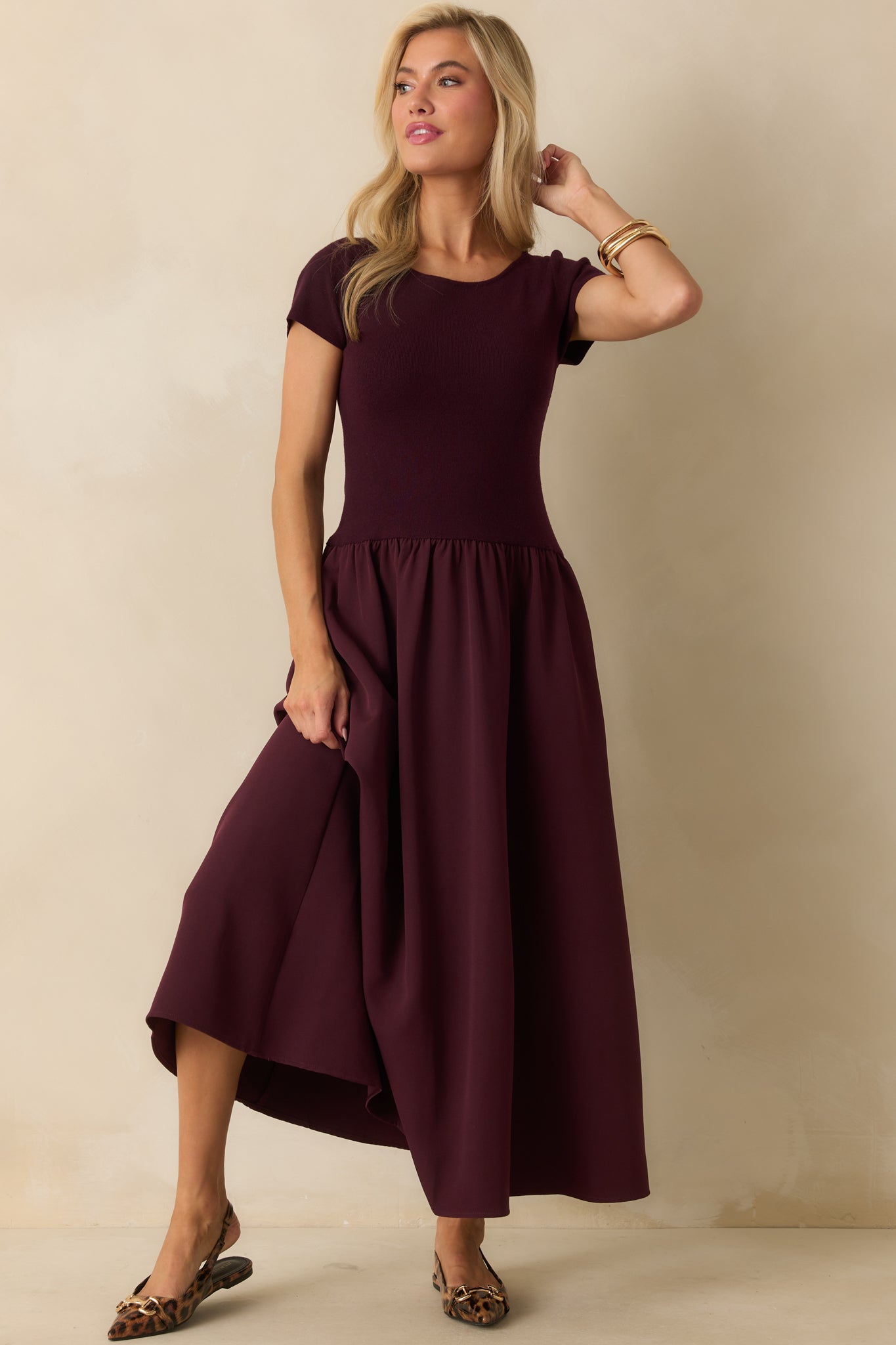 Ribbed knit maxi dress in wine red, designed with a scoop neck and breezy, flowy silhouette